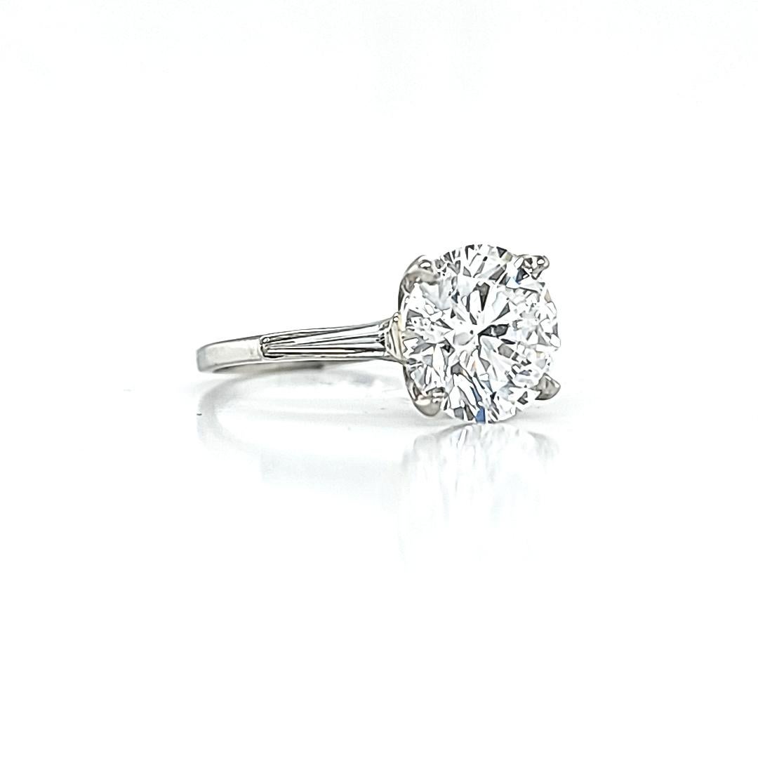 GIA Certified 3.77 Carat Round Diamond Three Stone Ring In New Condition In New York, NY