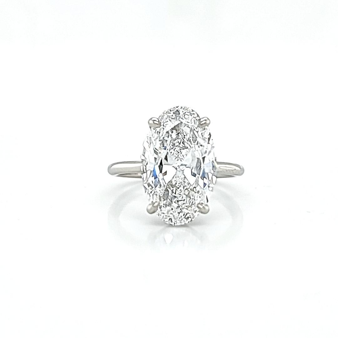 GIA Certified 5.02 Carat Oval Diamond Solitaire Ring In New Condition In New York, NY