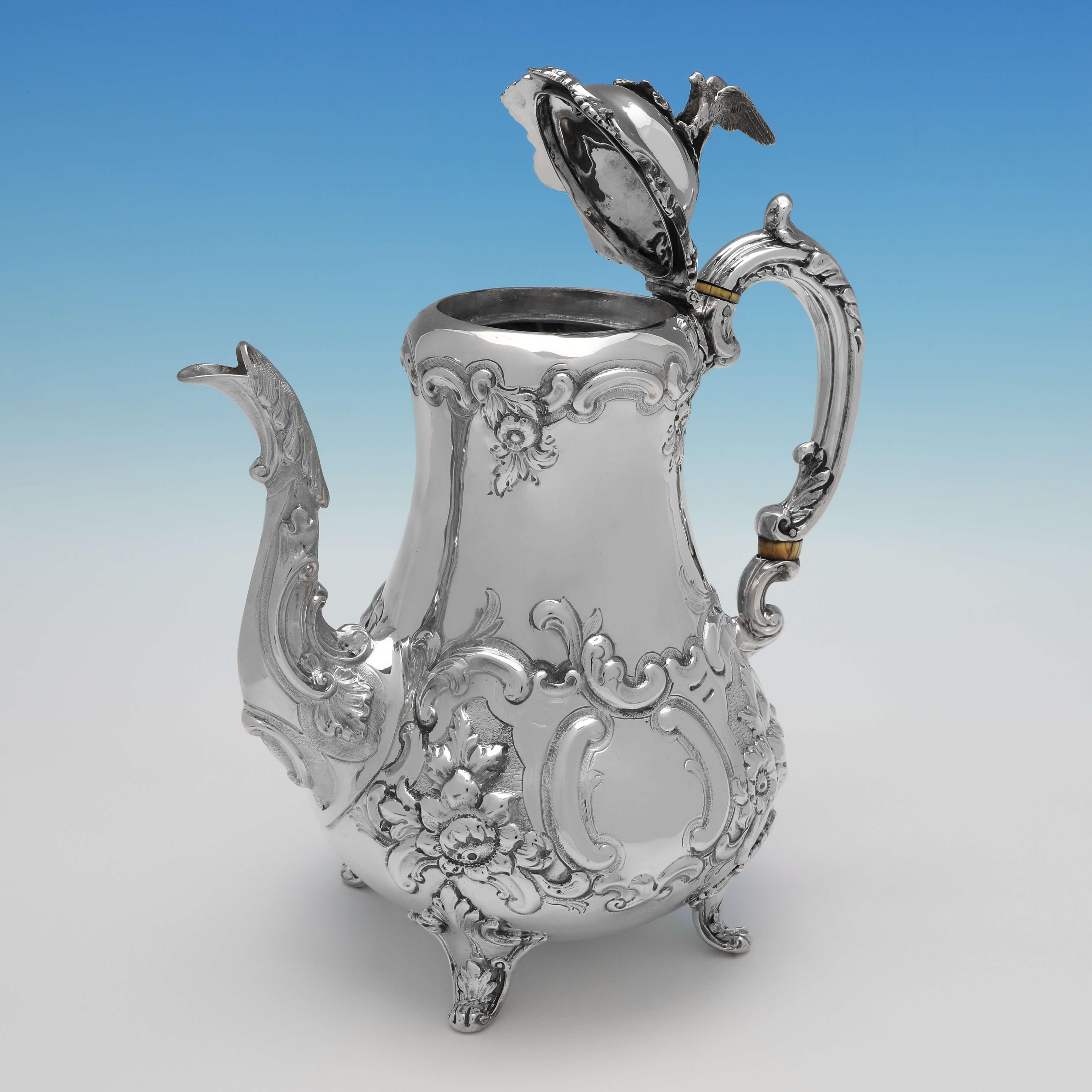 Hallmarked in London in 1850 by William Hunter, this attractive, Victorian, Antique Sterling Silver Coffee Pot, is in the sought after 'Louis Pattern', and features an engraved crest to one side. The coffee pot measures 10.5