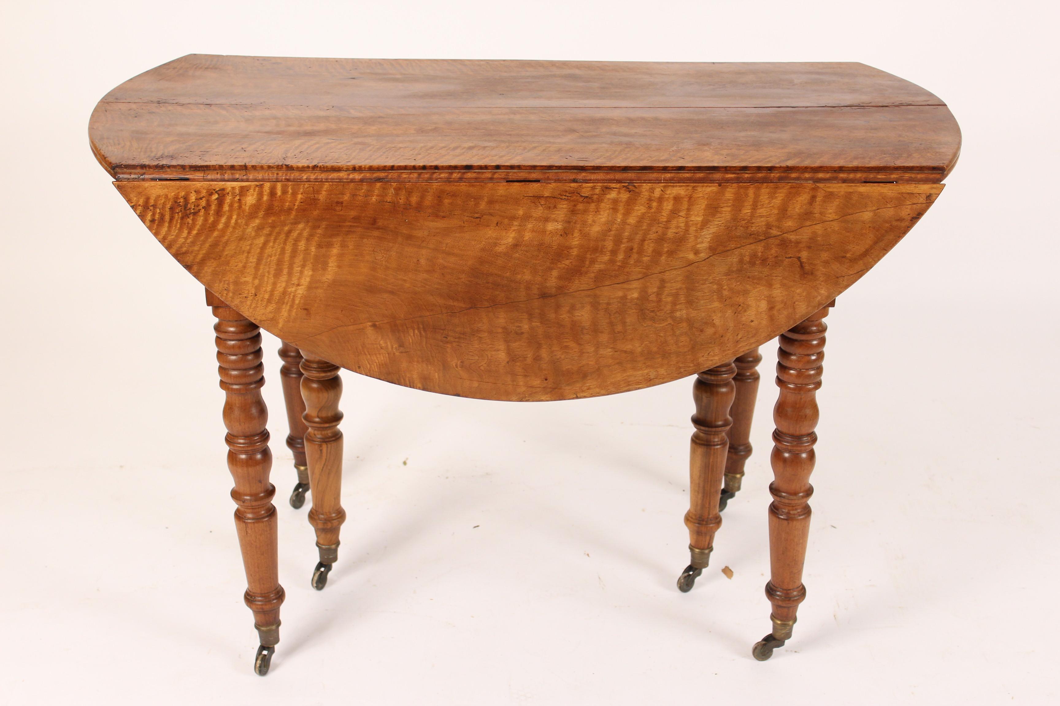 Louis Philippe tiger striped birch drop-leaf occasional or games table, circa 1840. The dimensions of the top when drop leafs are raised 45.5