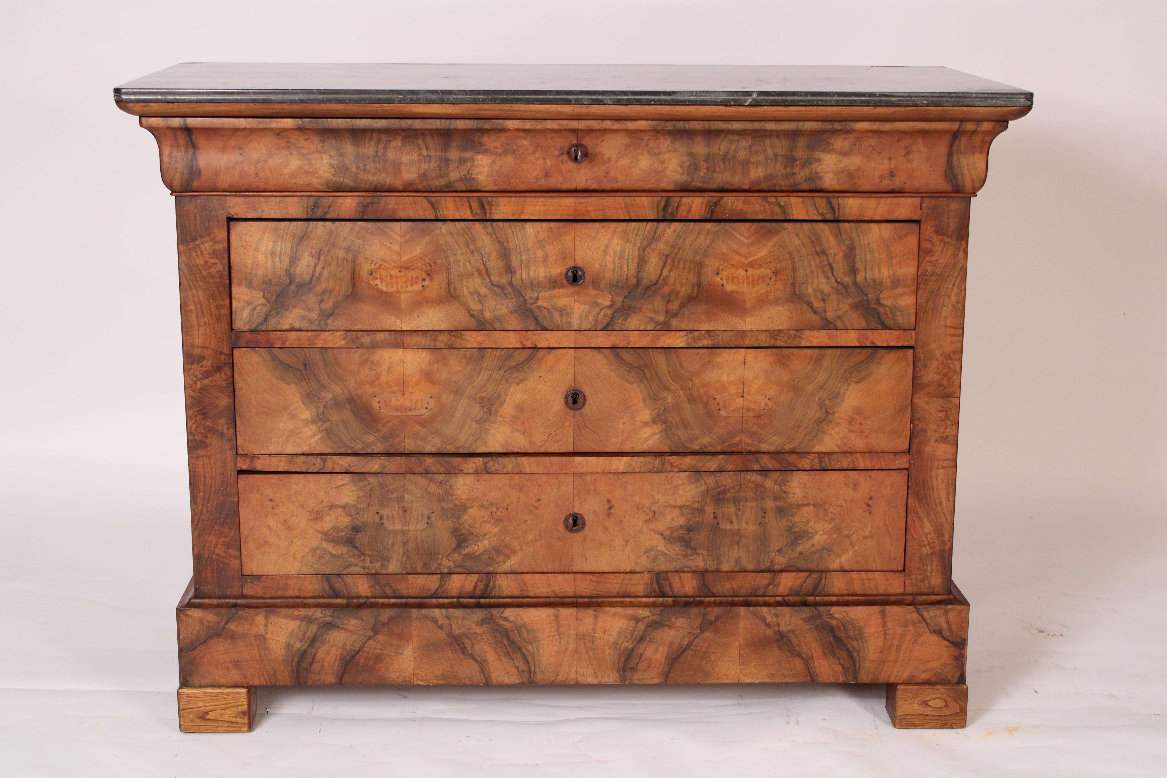 Louis Philippe burl walnut chest of drawers with marble top, mid 19th century. With a rectangular grey and white marble top with rounded corners, front and side edges of marble top scored, an S shaped top drawer and 3 lower drawers all drawers and