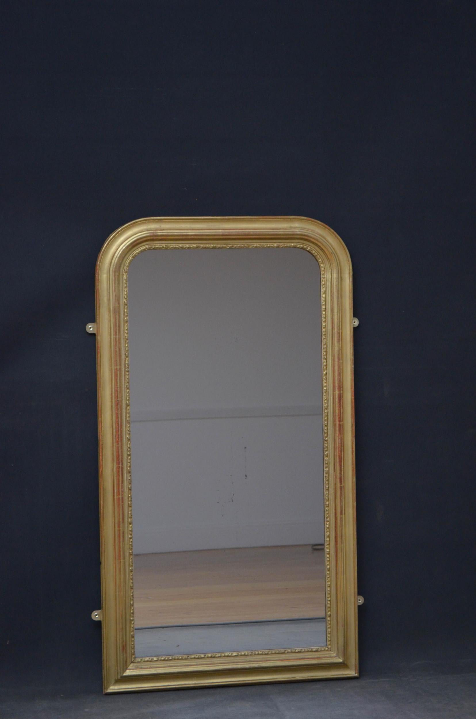 Sn4933 Louis Philippe design 19th century pier mirror, having original glass with some imprecations in carved, shaped and arched gilded frame. This antique mirror retains its original glass, gilt and backboards, all in home ready condition, circa