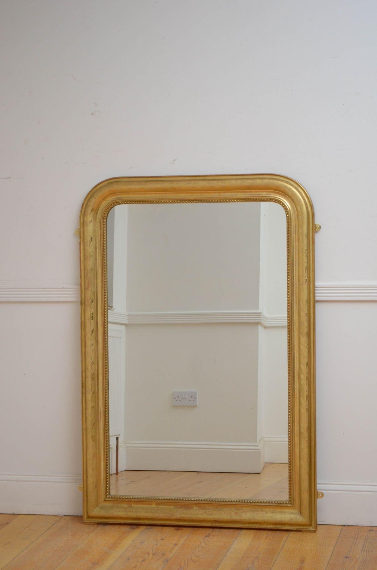 Sn5392 Attractive XIXth century gilt wall or pier mirror, having shaped glass with some imperfections in beaded and moulded frame with etched floral decoration. This antique mirror is in home ready condition. c1860
H53