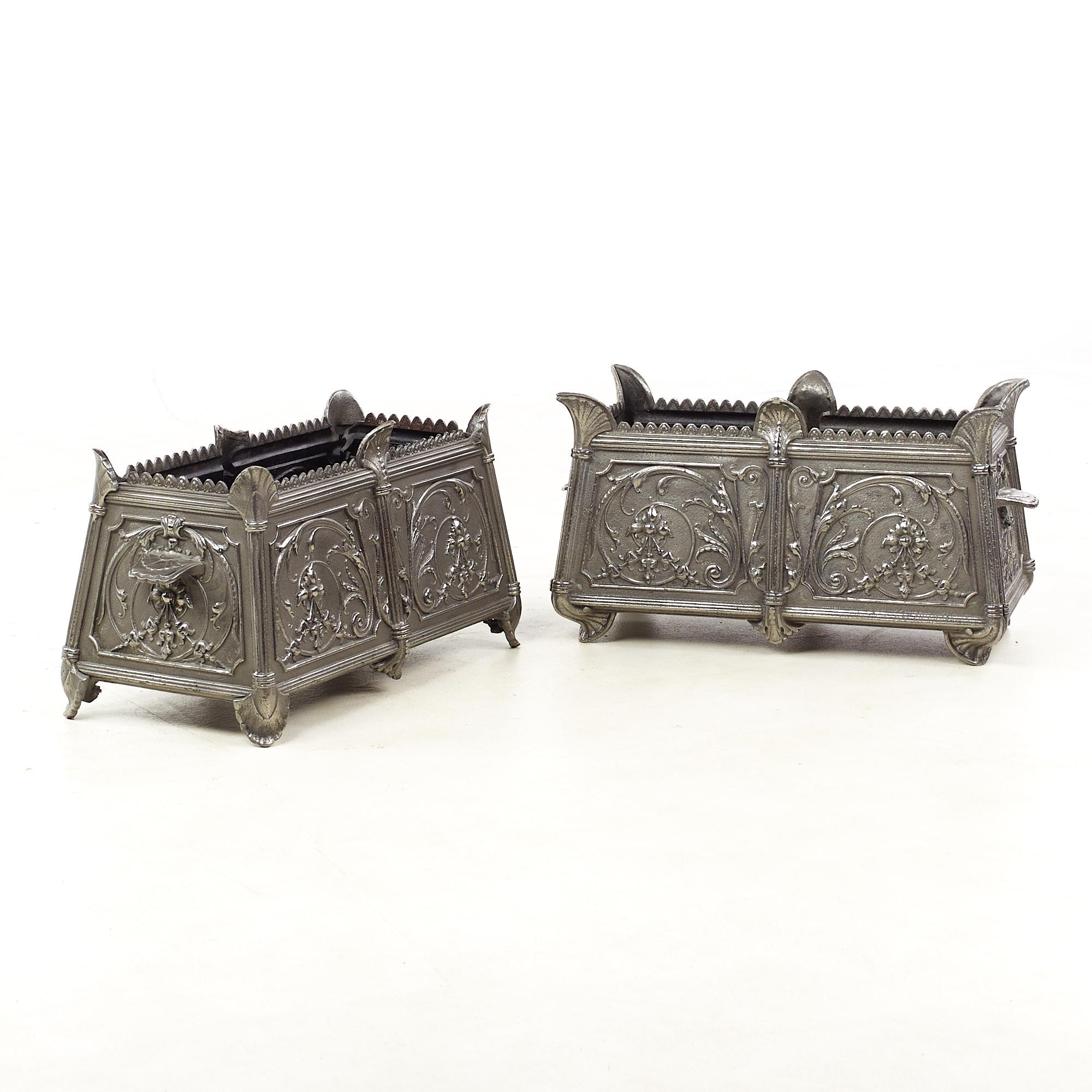 Louis Philippe French Ornate Cast Iron Planter Boxes - Pair

Each planter measures: 22 wide x 11 deep x 11 inches high 

This pair is in Good Vintage Condition with some rust and metal chips inside; a leaf is broken off on one planter.

We take our