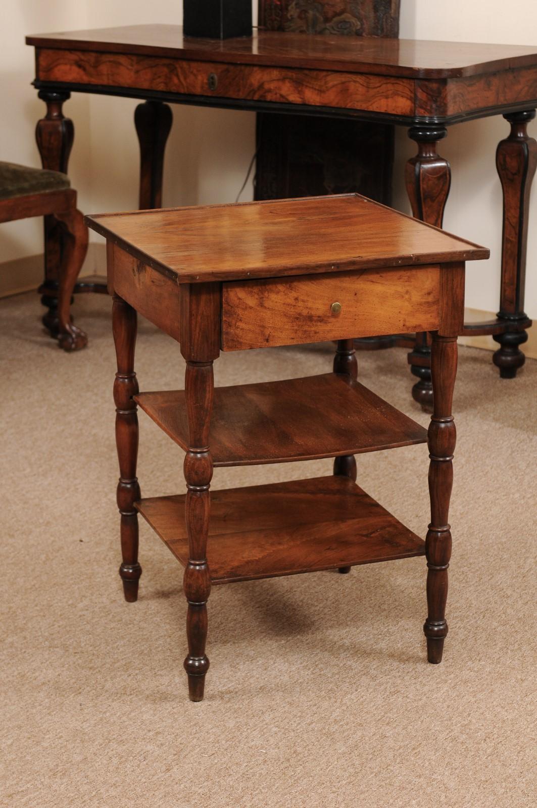 The Louis Philippe French walnut square side table with 1 drawer, 2 lower shelves and turned legs.