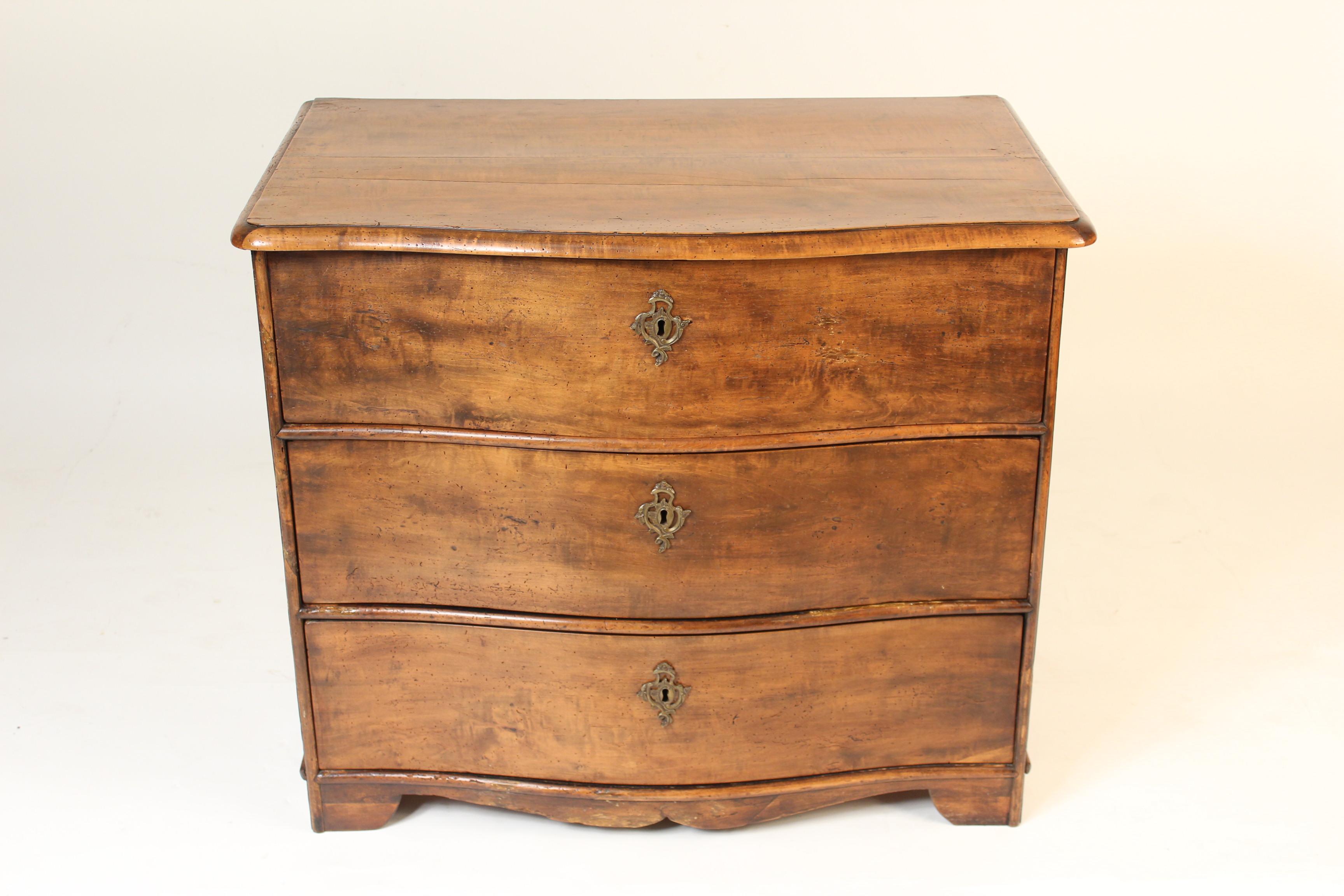 Louis Philippe serpentine front fruitwood chest of drawers, circa 1835.