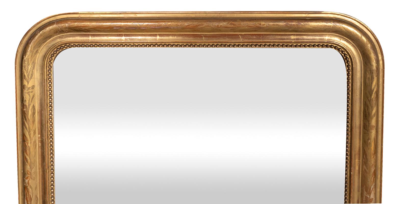 Rectangular with rounded top edge. Original water gold leaf with very subtle incised leaf decoration.