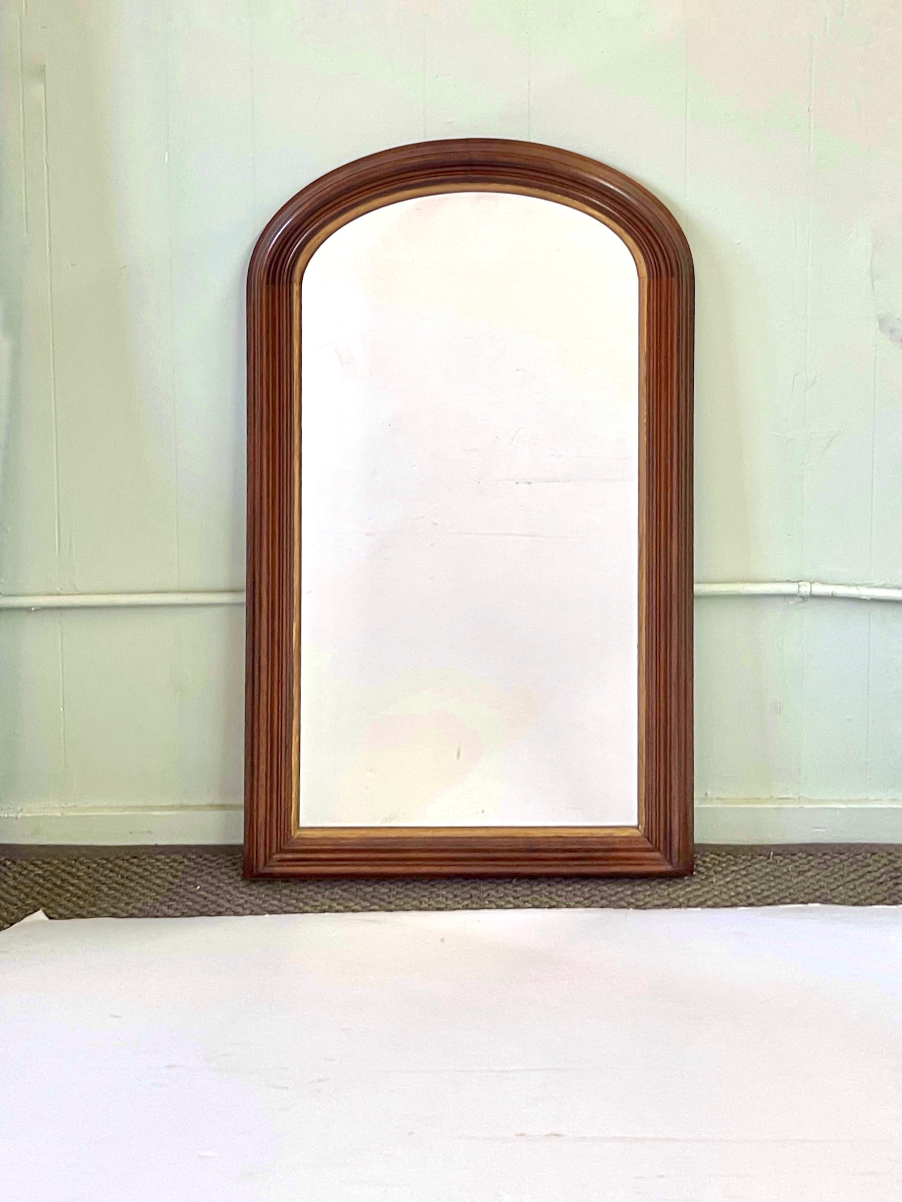 19th Century, French Louis Philippe wall mirror with beveled mahogany frame and accented with an interior giltwood trim. Mirror glass is original and is in great antique condition showing very delicate signs of wear and interior spots related to