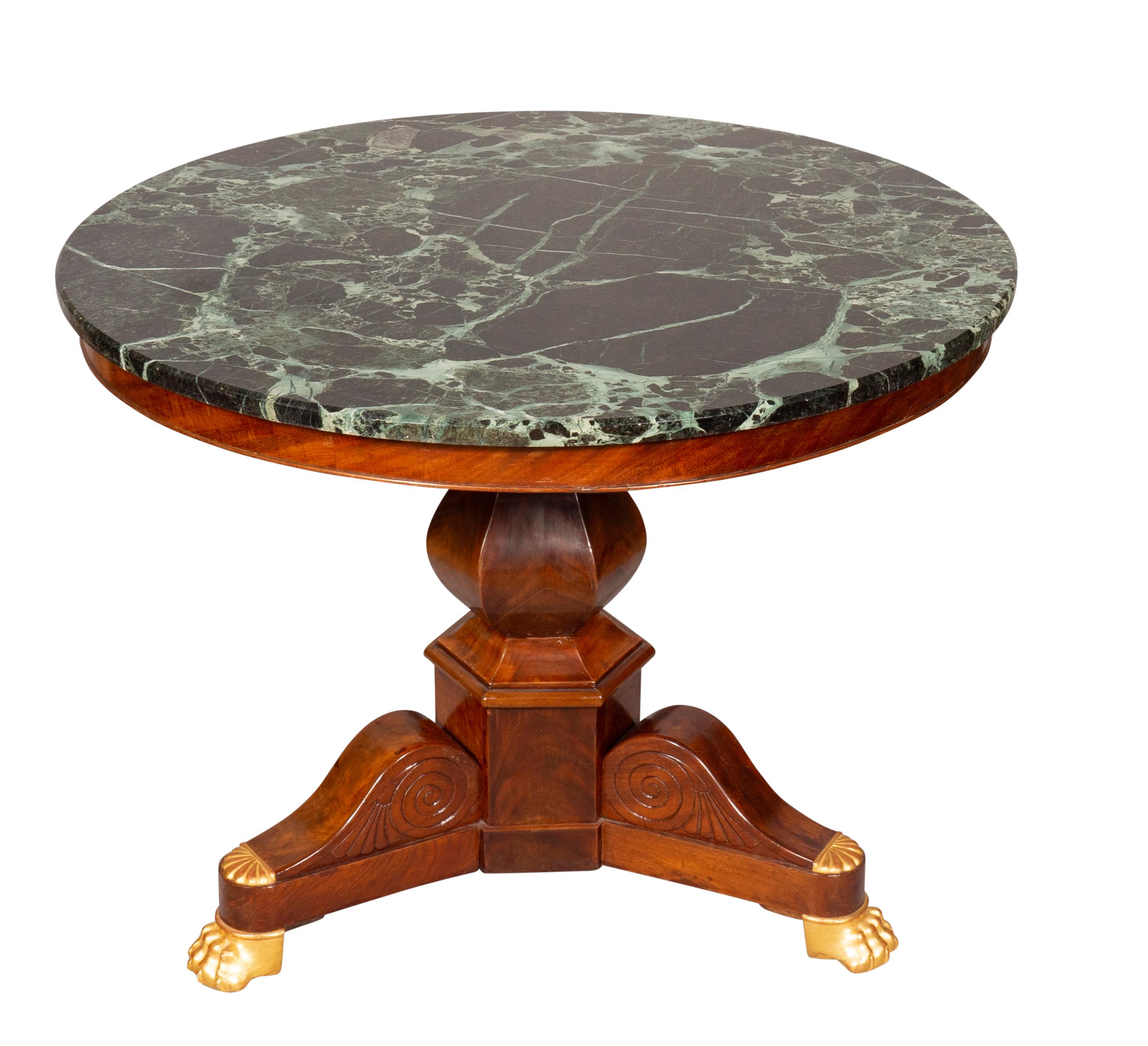 With circular antico verde marble top and shaped columnar support, tripartite base with carved volutes.