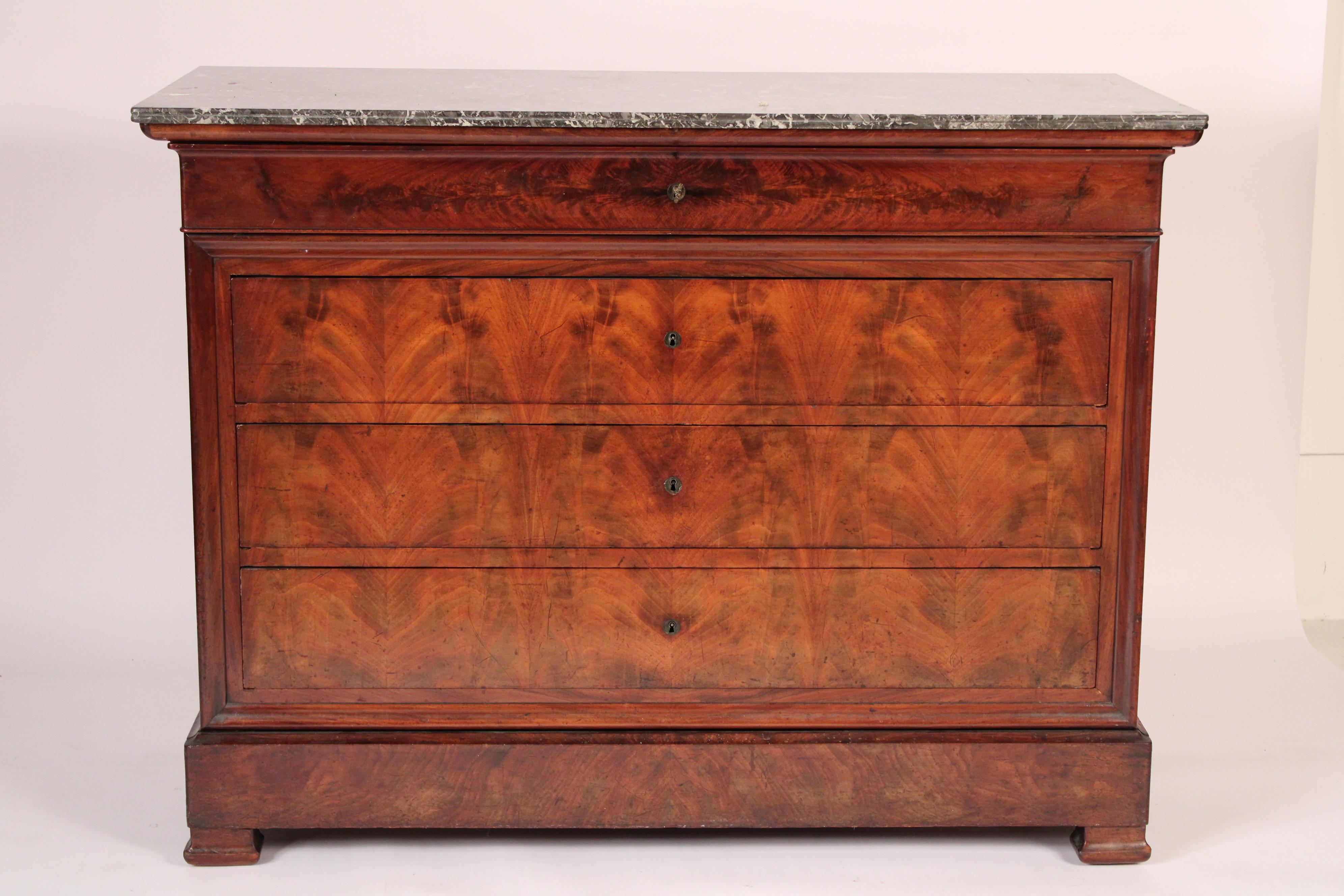 Louis Philippe flame mahogany chest of drawers, mid 19th century. With a rectangular grey and white Saint Anne marble top with rounded front corners, below the marble top is a small drawer and 3 full size drawers with flame mahogany fronts, small