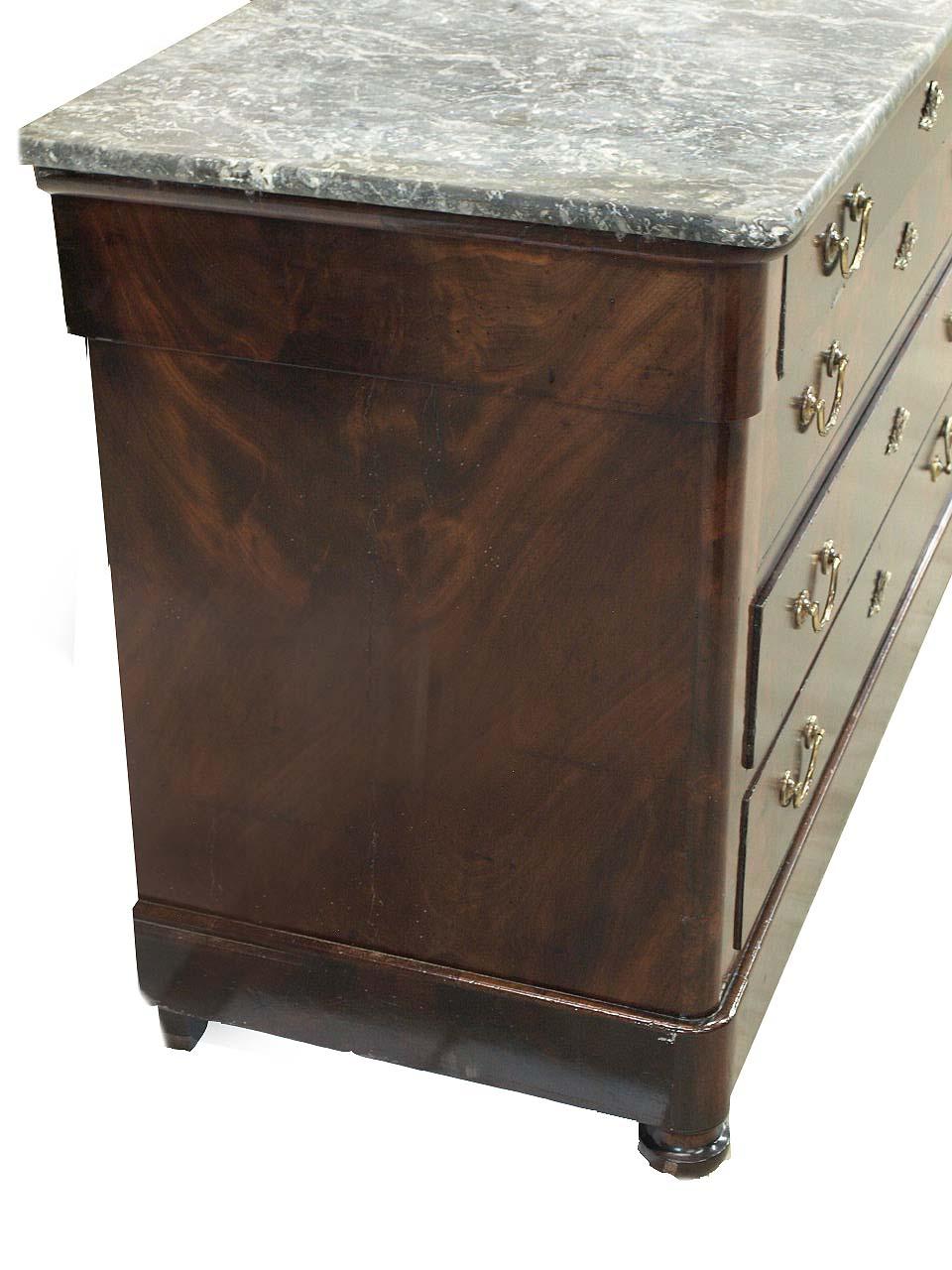 Louis Philippe marble top chest,  the gray and white marble with beautiful veining, especially the unusual large white area near the back(see photo),  the four graduated drawers with bail pulls and flame mahogany veneer, resting on turned front
