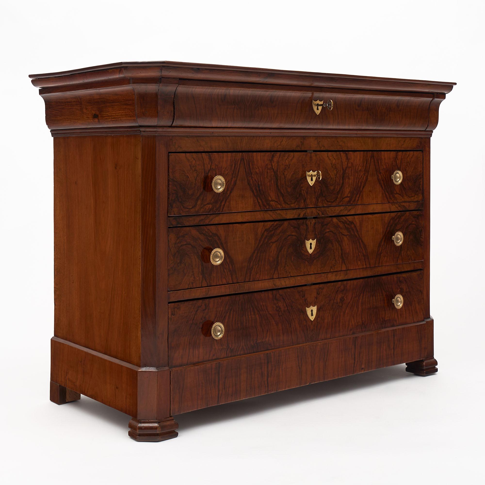Chest from France in the Louis Philippe period. This piece is made of solid walnut and burled walnut with four dovetailed drawers and finely cast bronze hardware.