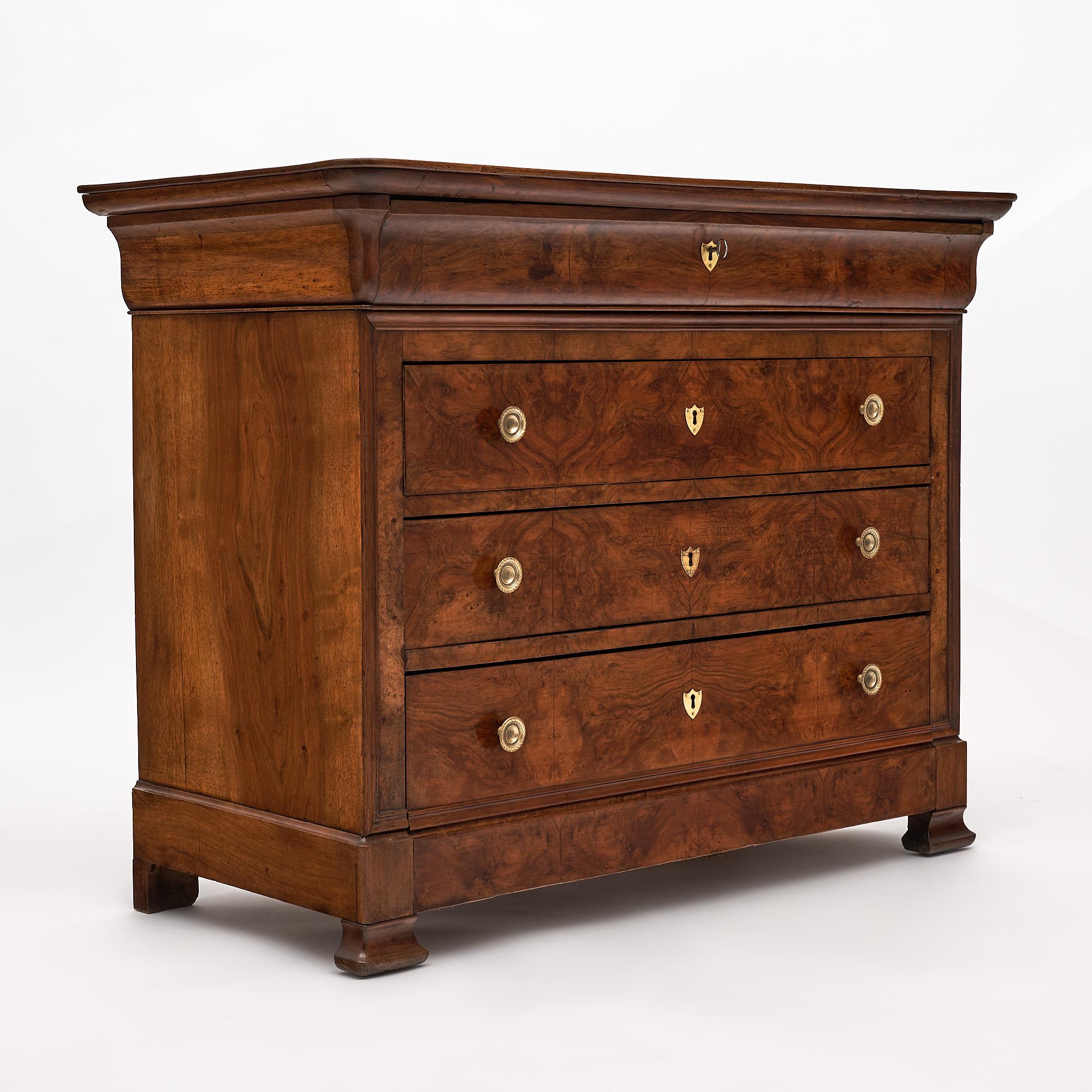 Chest of drawers, “commode”, French, from the Rhone Valley. This Louis Philippe period piece is made of solid walnut and burled walnut. The chest is in superb antique condition and finished with a lustrous French polish finish. The cabinet features