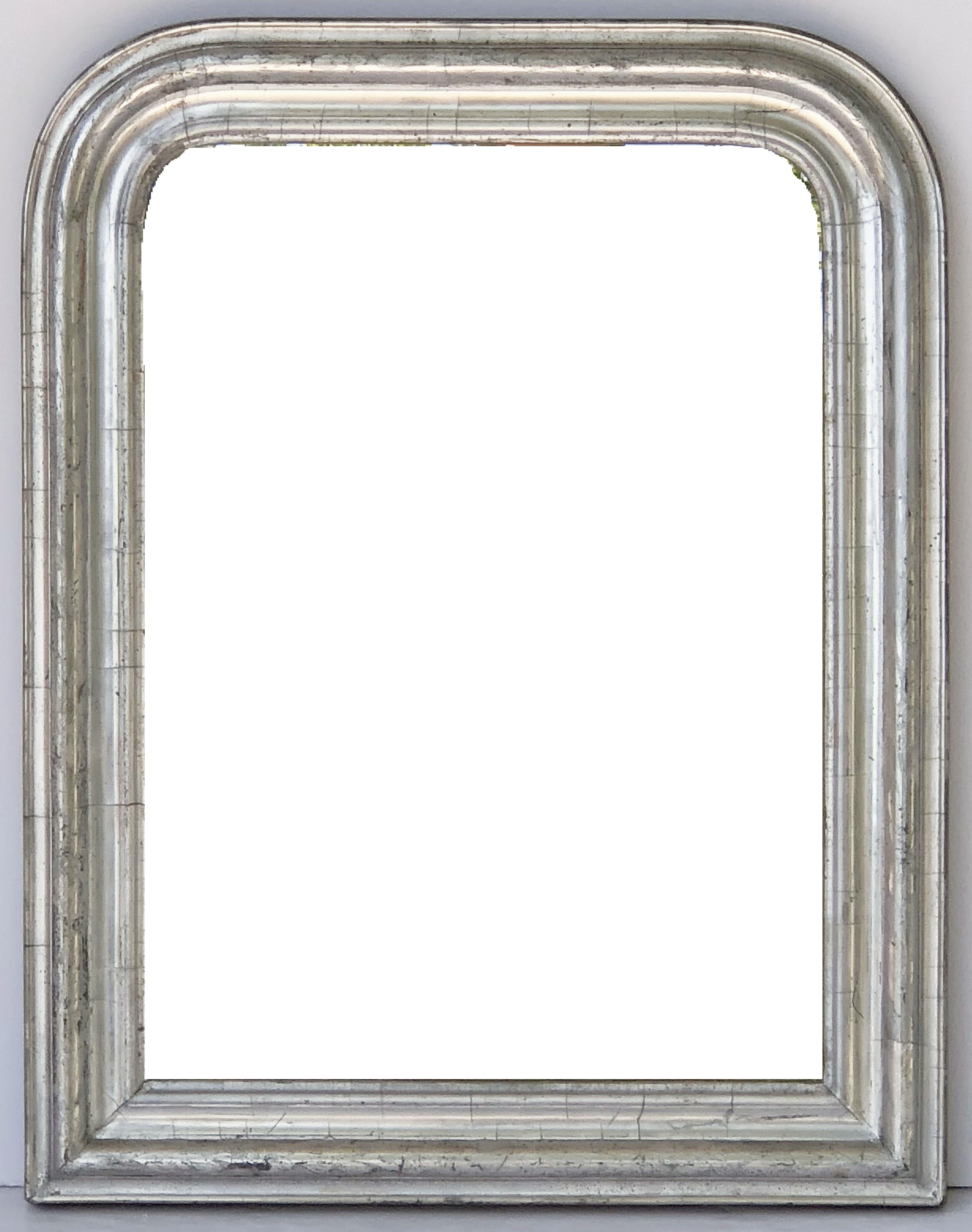 A fine Louis Philippe wall mirror from France, featuring a moulded surround with a beautiful patinated silver-leaf.

Dimensions: H 26 inches x W 20.25 inches

Other sizes available in this style