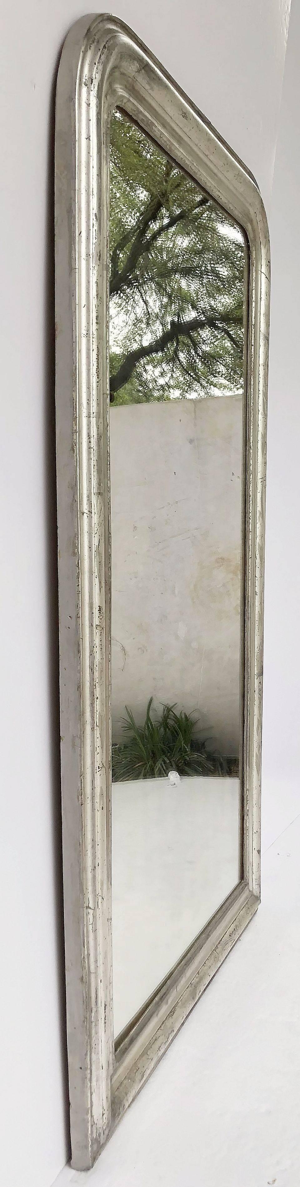 A fine large Louis Philippe wall mirror featuring a moulded surround with a beautiful patinated silver-leaf.

Dimensions: H 53 3/4 inches x W 32 1/2 inches

Other sizes available in this style.