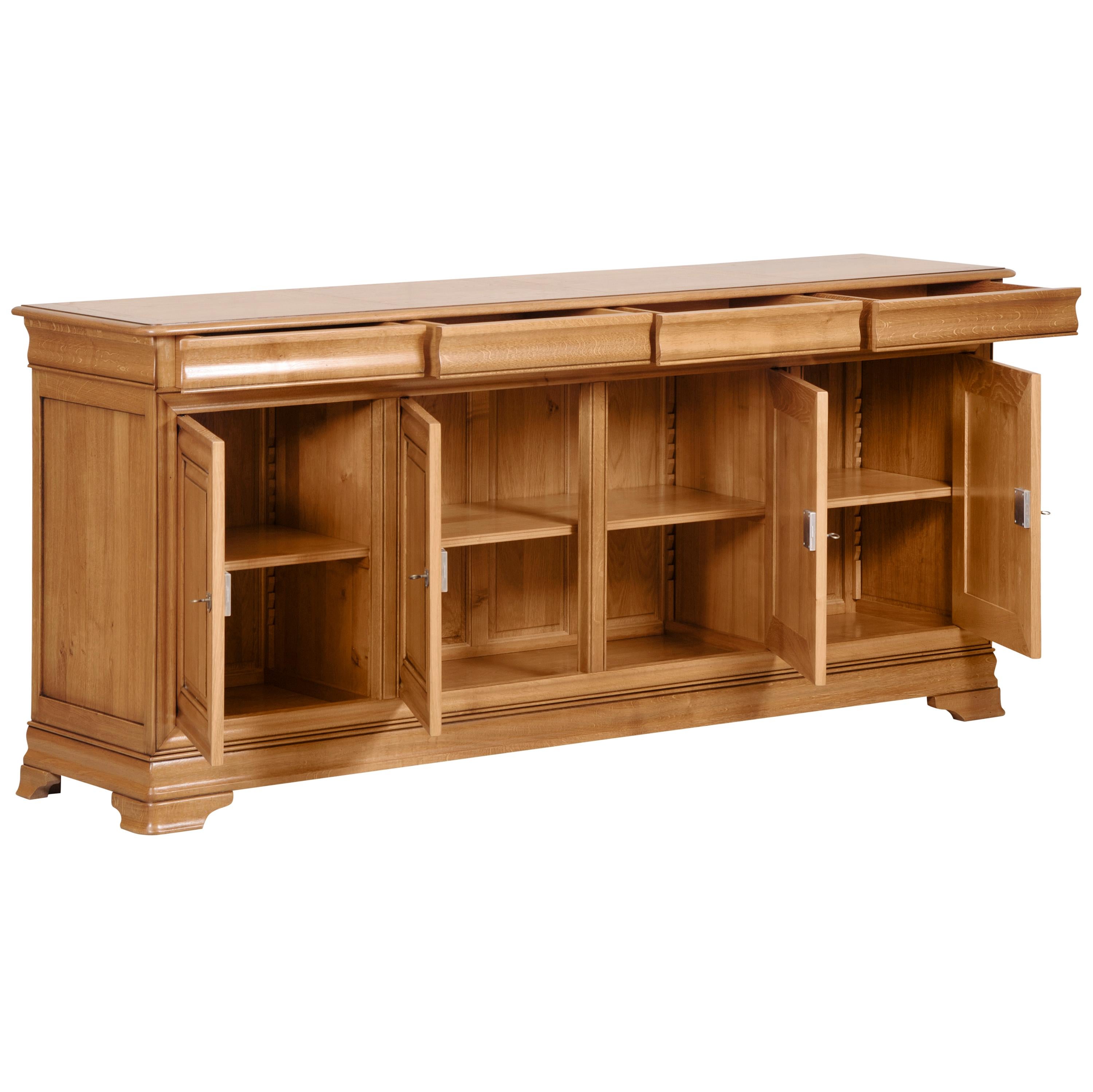 This large sideboard is made of solid French Oak and typical of the Louis Philippe Style in the mid 19th century in France caracterized by its curved moldings, hand-curved feet, etc...
 
4 drawers with dovetails are in the curved moldings 
2