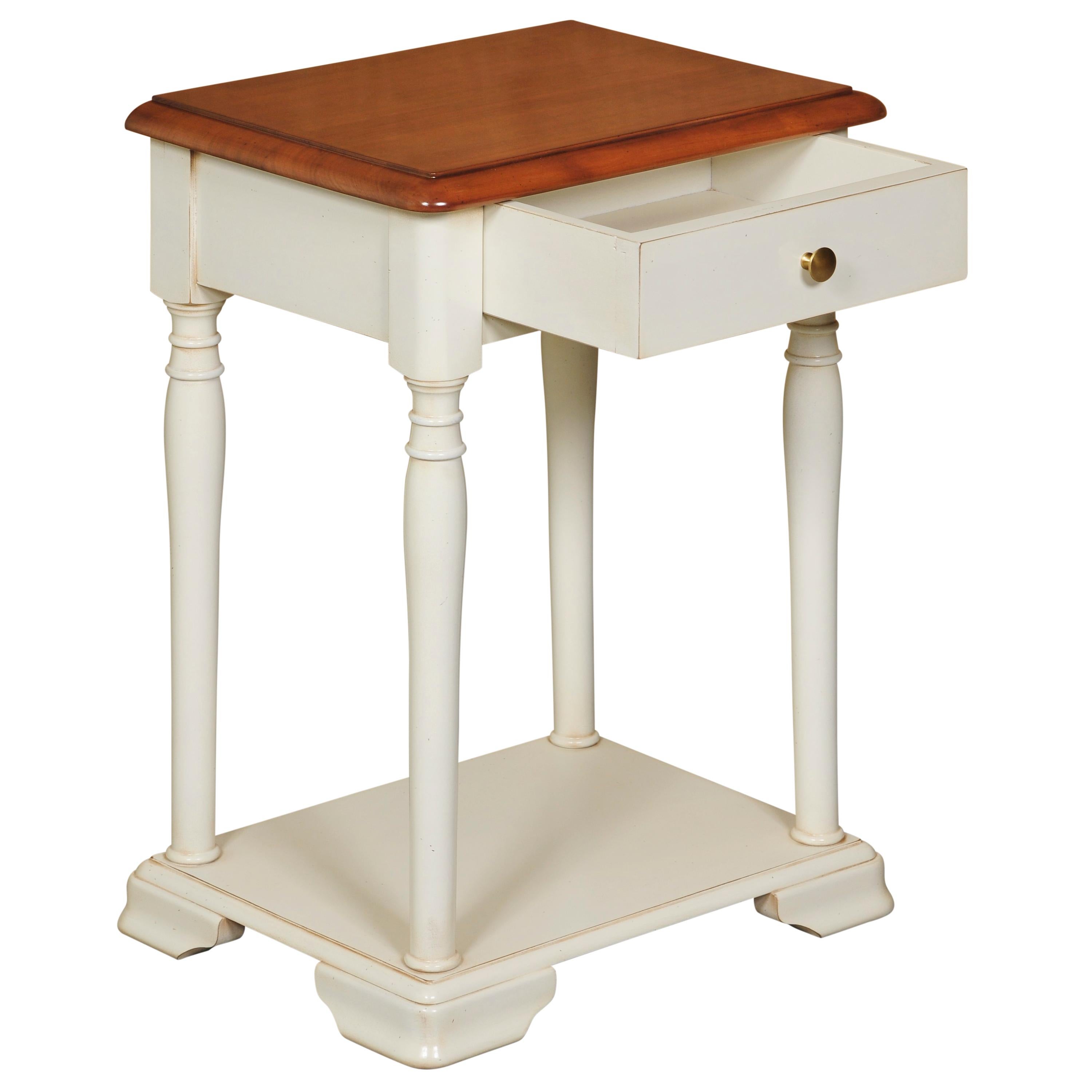 This bedside table is a handmade reproduction of the French Louis Philippe Style in the mid 19th century in France characterized by its curved moldings, hand-curved feet and rounded shapes and design.

1 drawer is integrated n the front with an