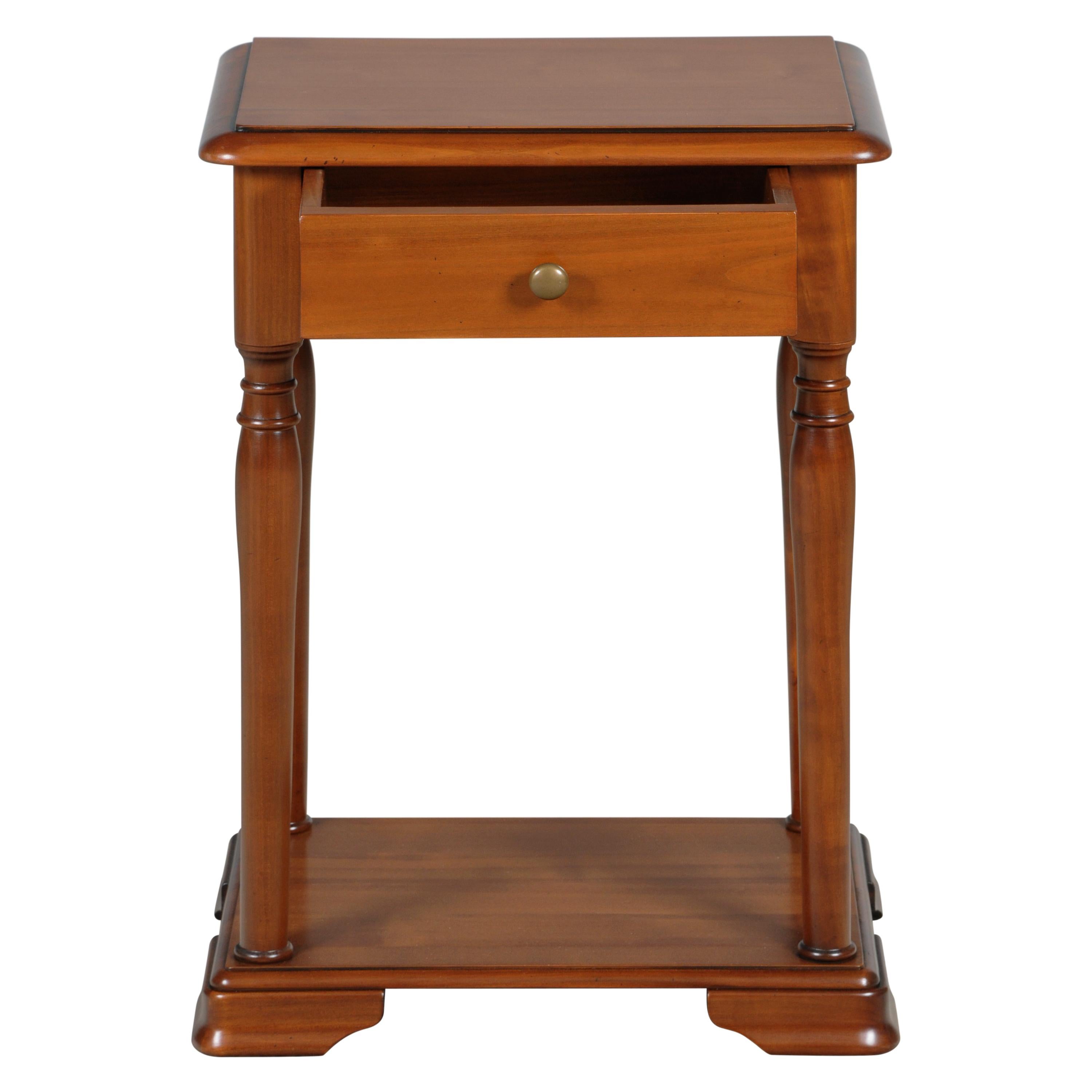 This bedside table is a handmade reproduction of the French Louis Philippe Style in the mid 19th century in France caracterized by its curved moldings, hand-curved feet and rounded design.

1 drawer is integrated n the front with an 