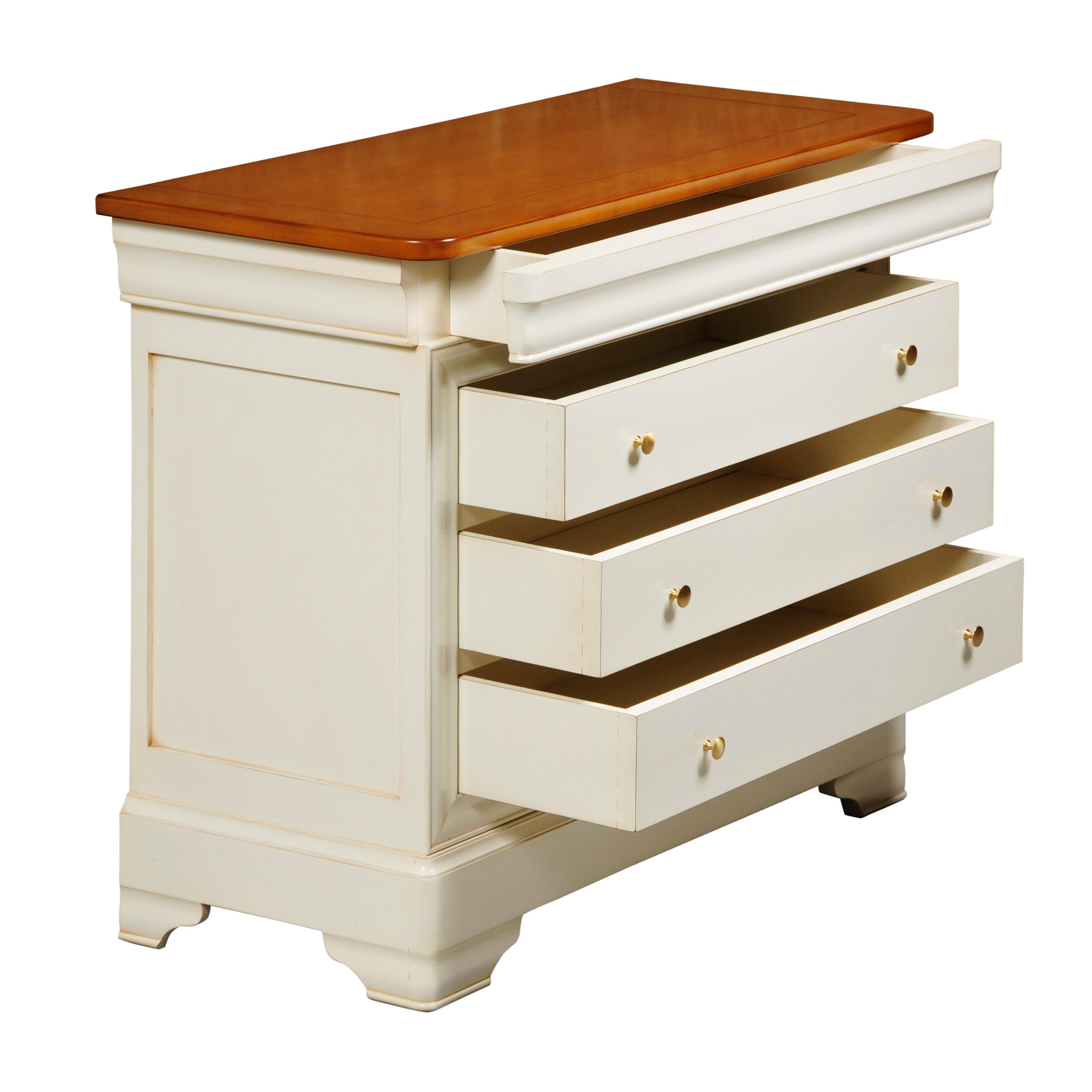 This chest of drawers is a handmade reproduction of the French Louis Philippe Style in the mid 19th century in France caracterized by its curved moldings, hand-curved feet and rounded design.

This French Commode features 4 drawers including a