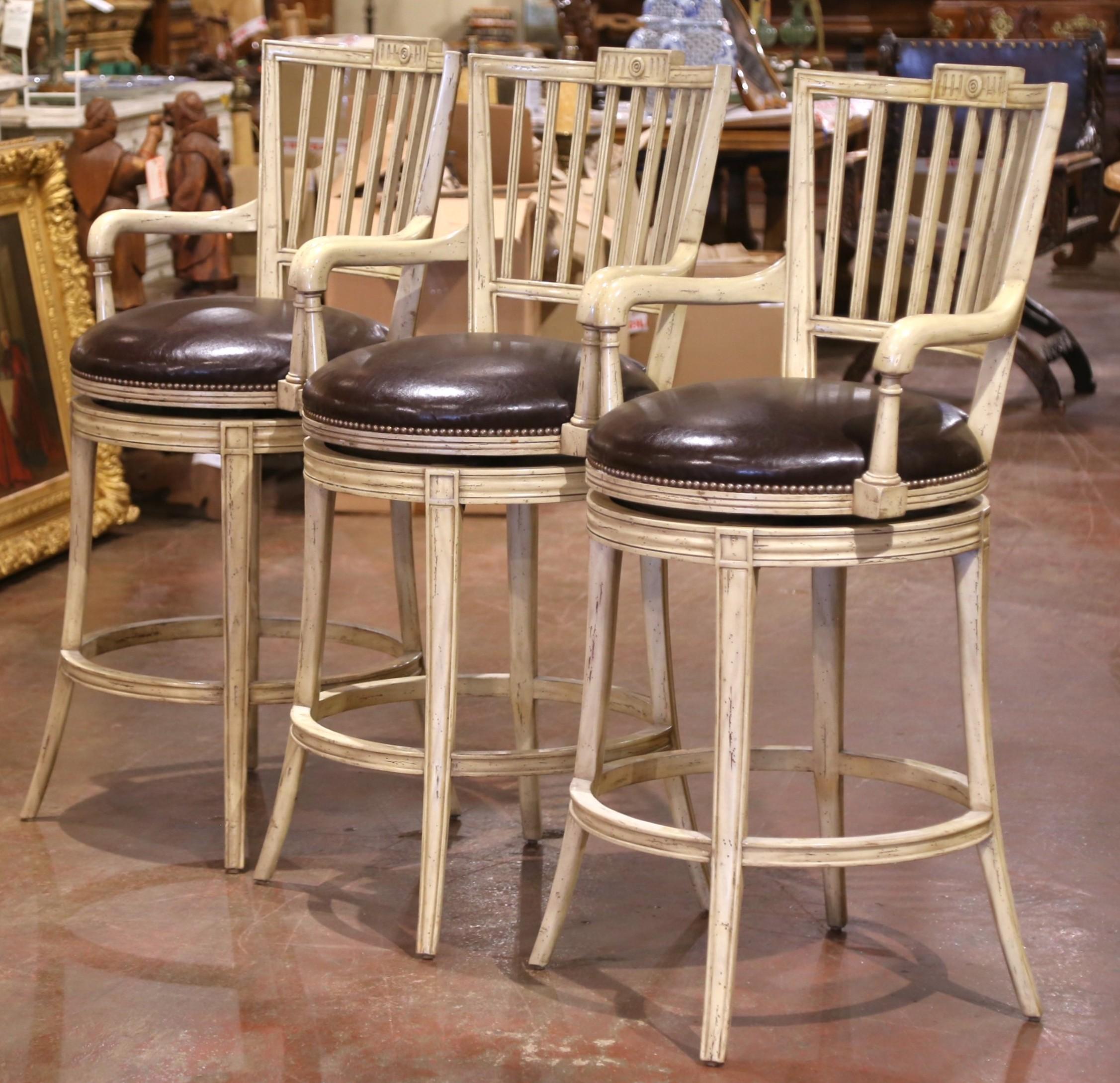 20th Century Louis Philippe Style Cream-Painted Swivel Barstools with Leather Seats, Set of 3 For Sale