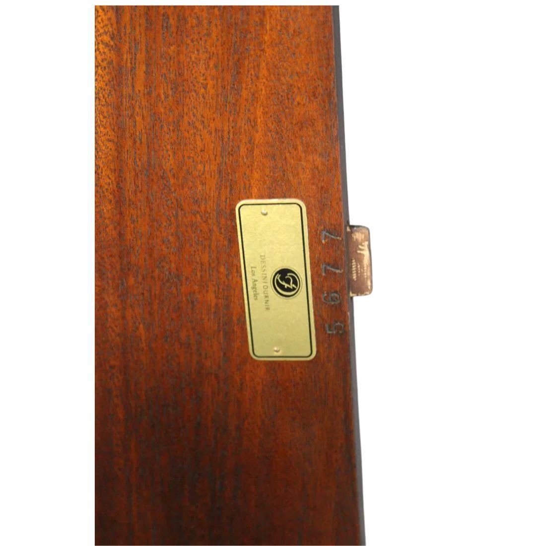 A  round Louis Philippe style dining table is crafted from rich mahogany and bears the Dessin Fournir signature, attesting to its quality design and craftsmanship. Classic Louis Philippe details, clean lines, subtle curves, and understated