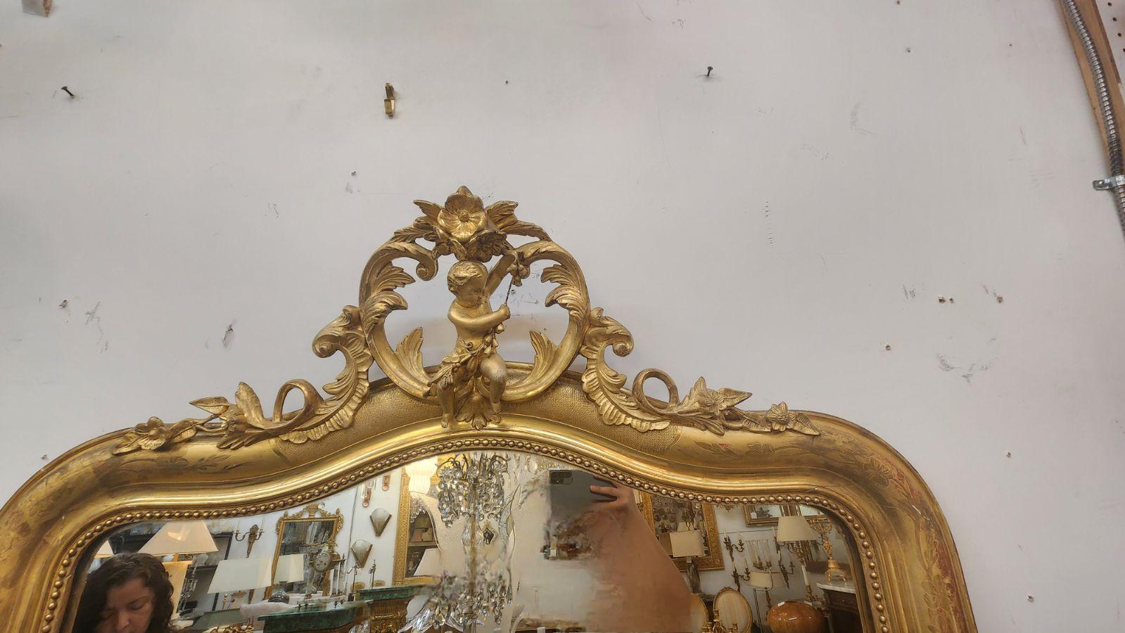 In the style of Louis Philippe. French Gilded wall mirror with Ornate Cherub Crown detail. 