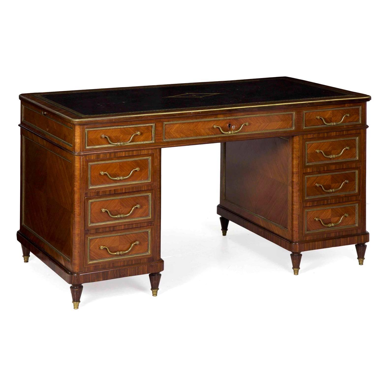 This finely crafted desk has such variety of rich material - the brass framing elements are of very high quality, each beautifully cast with intricate detailing. The original bail pull handles are exceptional, each with a pair of acanthus bulbs