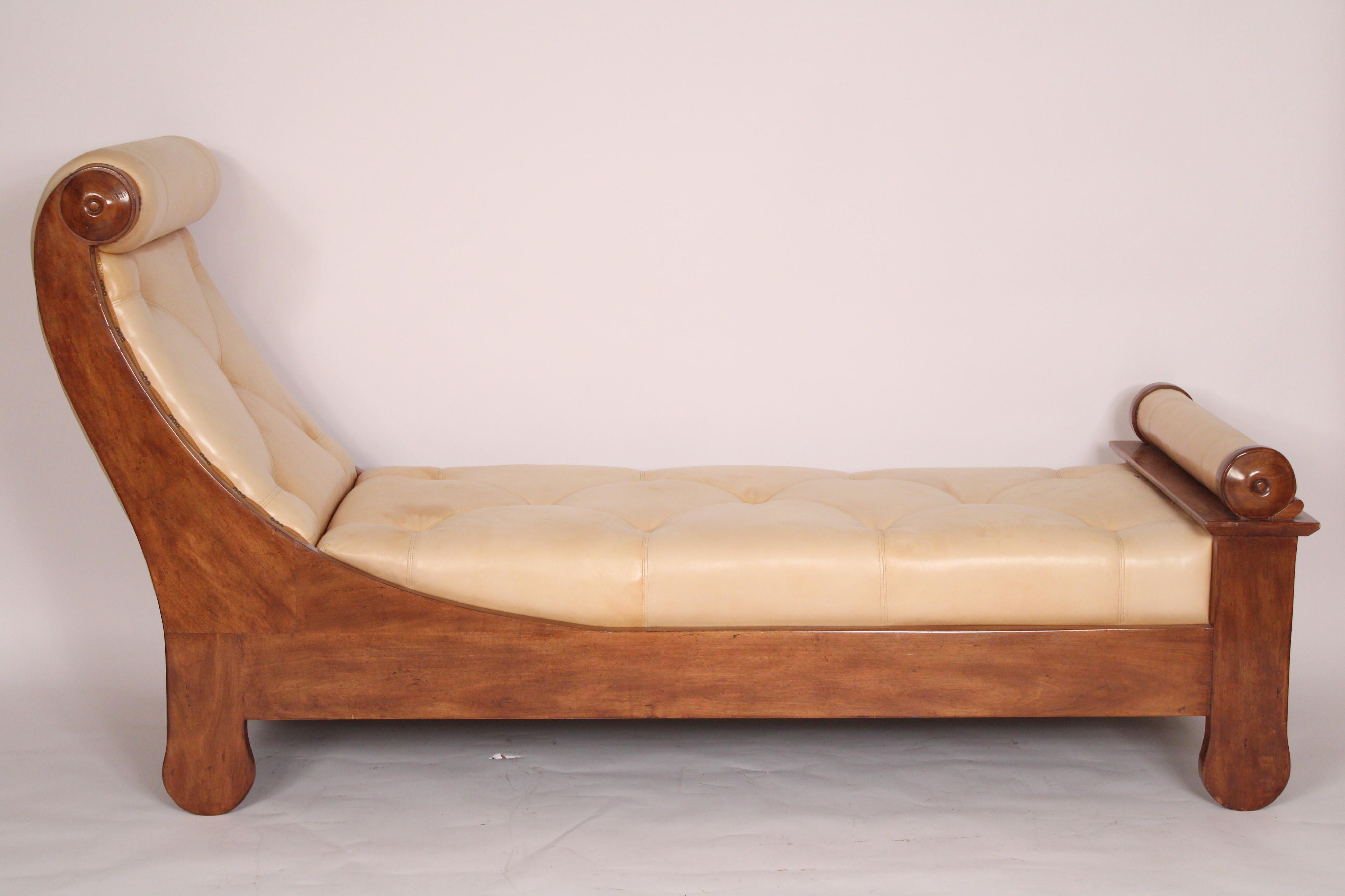 Louis Philippe style fruit wood day bed with leather upholstery, circa late 20th century. The leather is very soft. The wood has a walnut color.