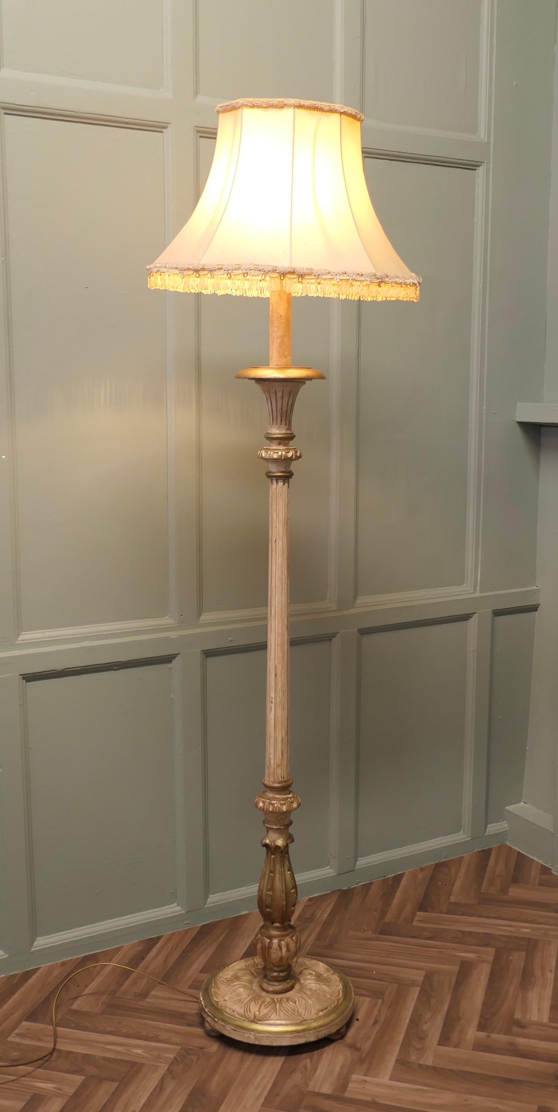 Louis Philippe style Painted and Gilt  Floor Lamp, Standard Lamp

 An attractive piece carved and detailed in gold, this lamp stands on a turned wooden base, it is in good condition, the wiring is good.
The lamp is 51” high to top of the slightly