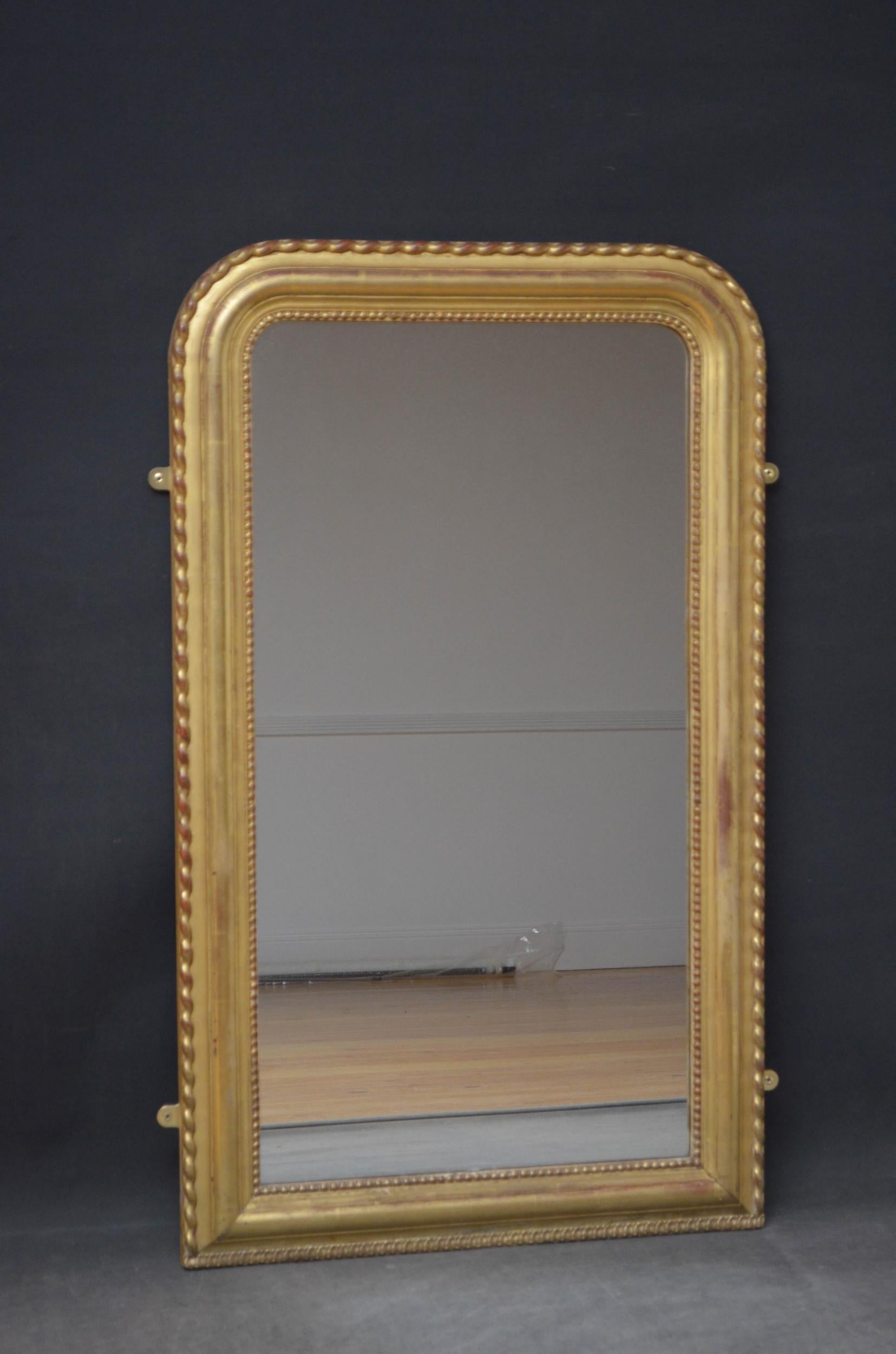 Sn4934 19th century French mirror, having original glass with some foxing and sparkle in beaded and moulded frame with minor replacements and wavy decoration to outer edge. This antique mirror retains its original glass, original gilt and original