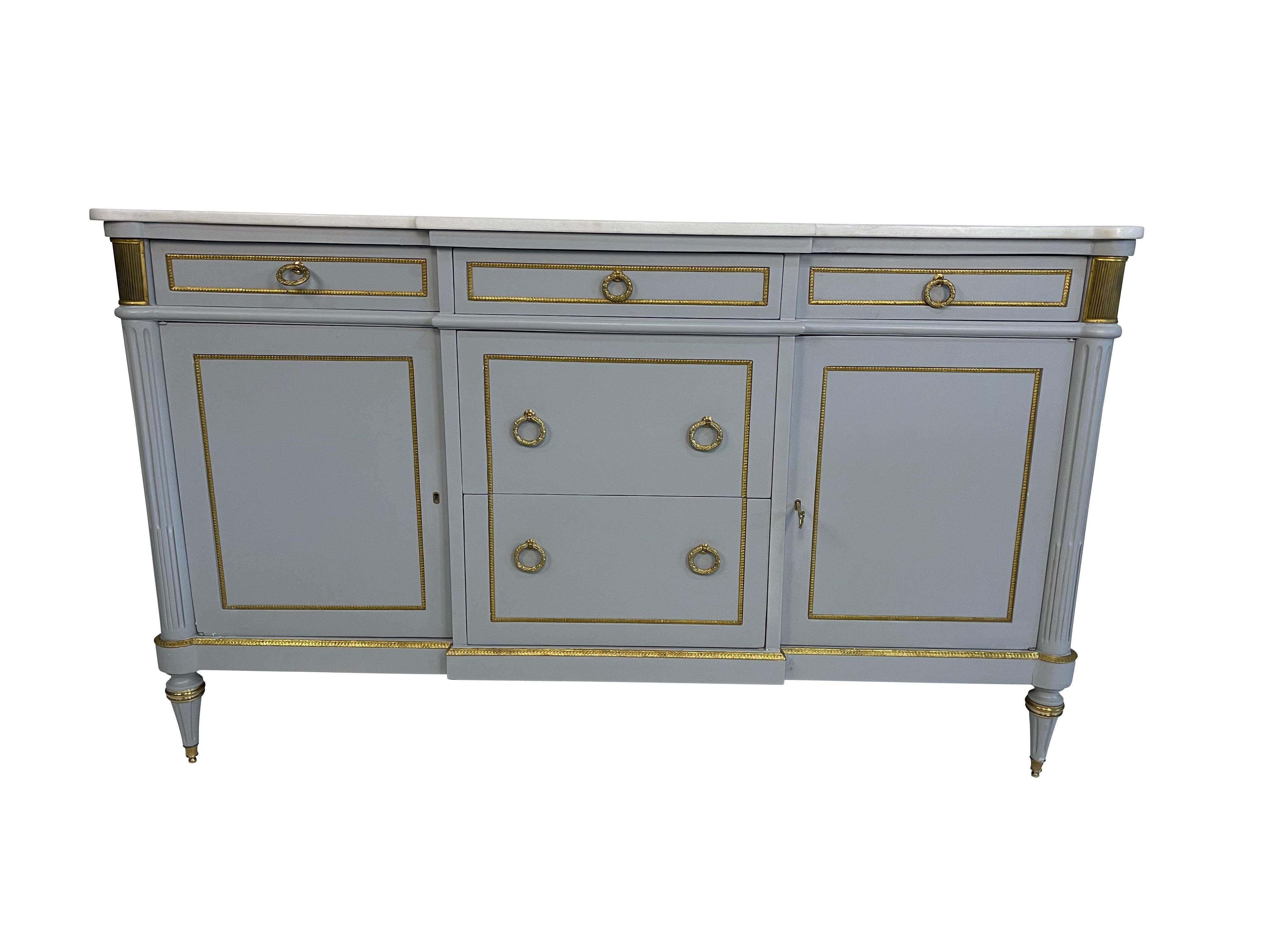 A very handsome 20th-century Louis Philippe enfilade - buffet. Wonderfully constructed from painted wood with two gilt-decorated side doors and three drawers across, over two center drawers with gilt decoration throughout. It is raised on circular