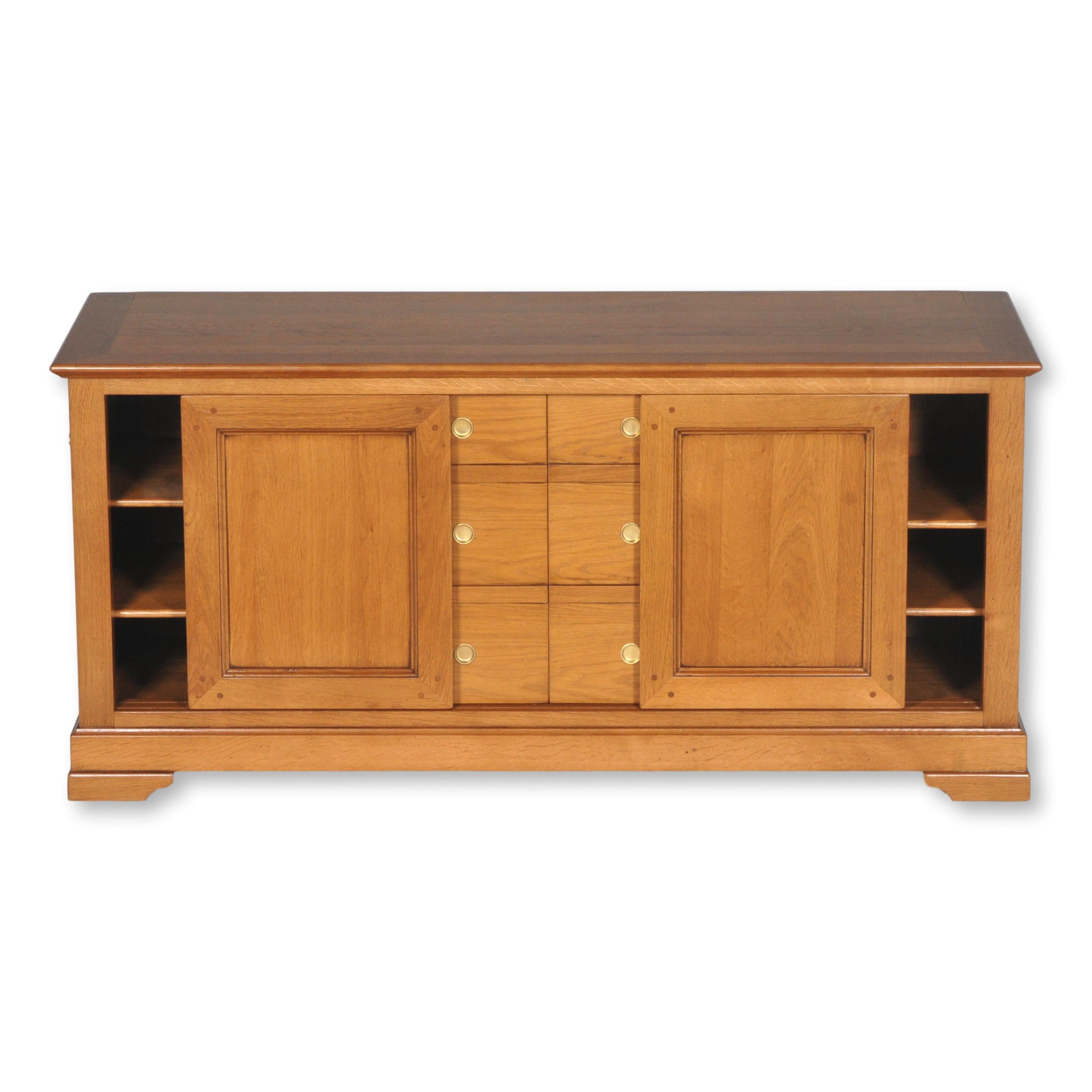 This Cabinet is a handmade interpretation of the French Louis Philippe Style in the mid 19th century in France caracterized by its curved moldings, hand-curved feet and rounded design. 

This piece is made to install your TV screen on top and store