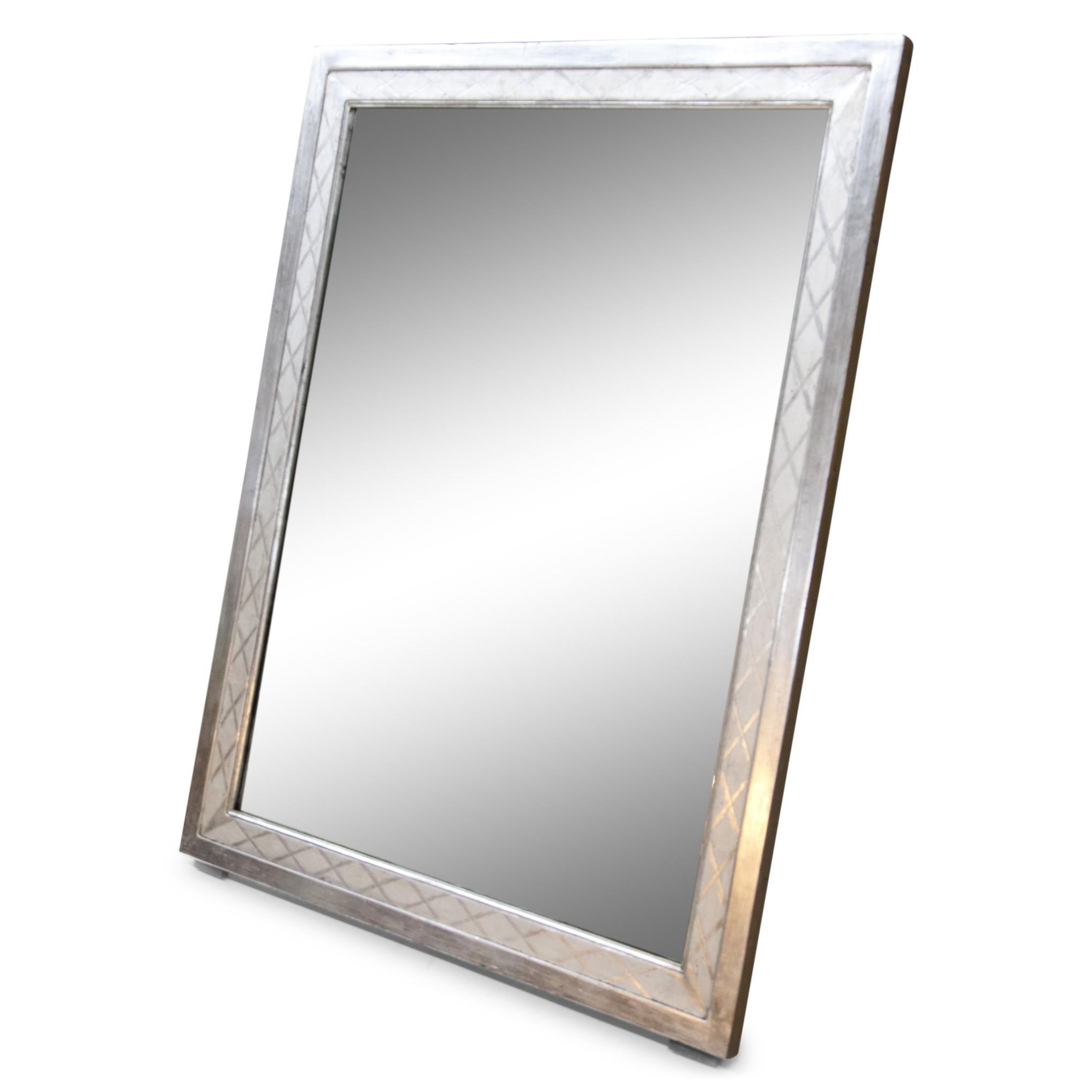 Rectangular wall mirror with smooth, silver patinated wooden frame with diamond decoration on a plaster base. Silvering restored.