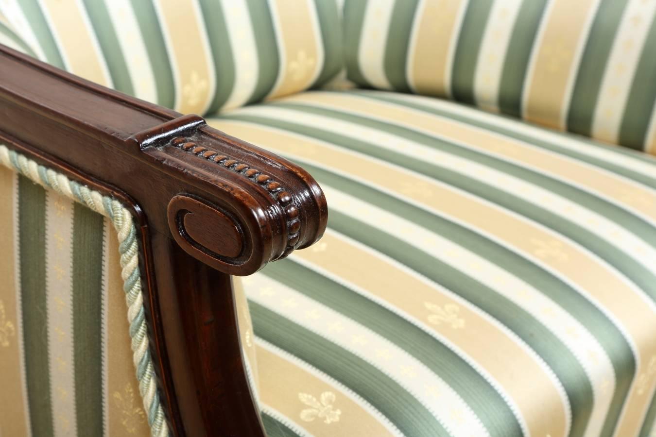 Louis Philippe walnut armchair, circa 1860 from France. Walnut frame has been restored with respect for original color and patina, and hand polished with natural shellac. The chair features new upholstery with coil springs.