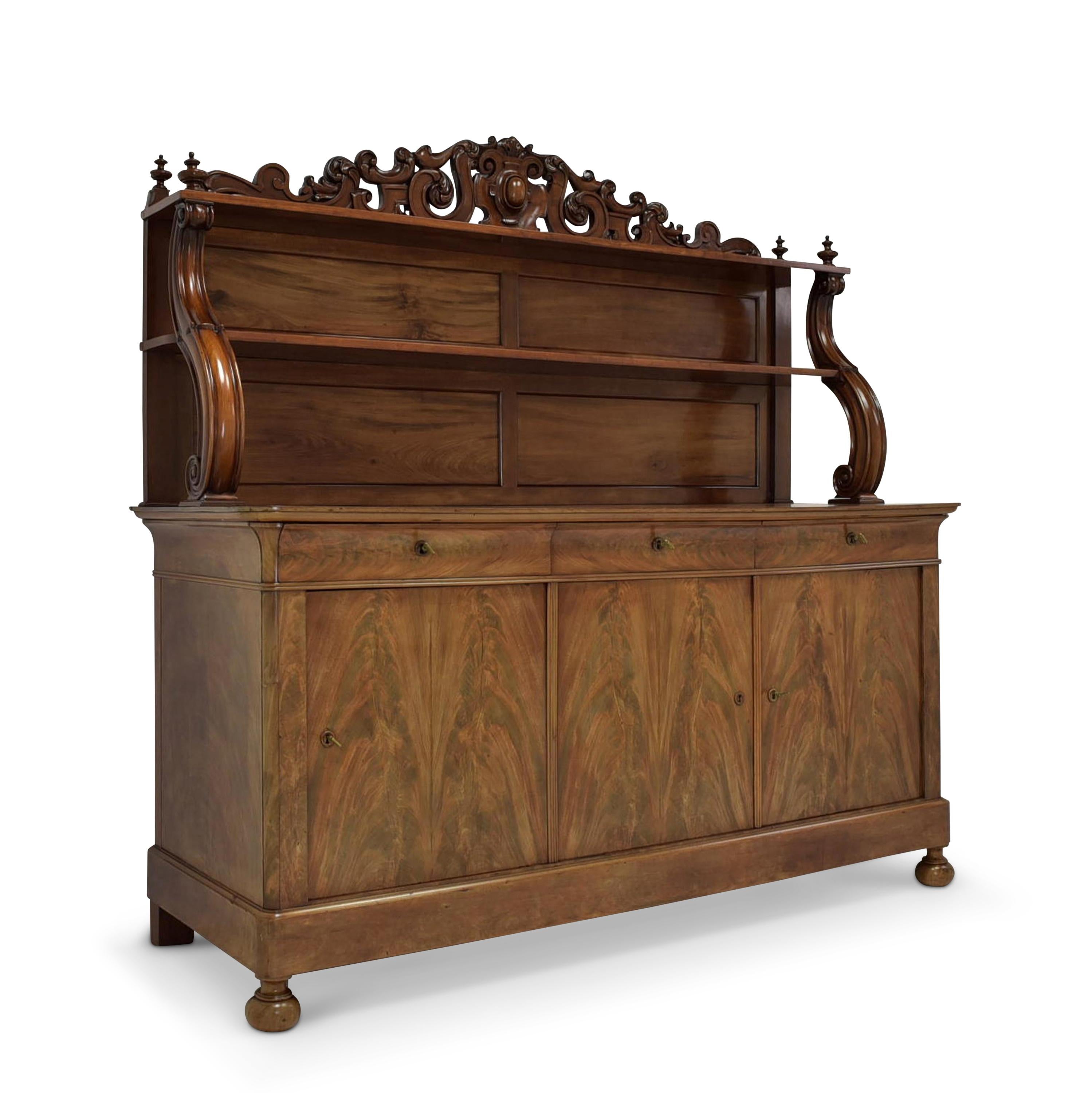 XL dresser restored Louis Philippe mahogany sideboard buffet

Features:
Three-door model with three drawers and two-tier top
High quality
Drawers pronged
Elaborate, voluminous carved decor
Original locks and fittings
Nice veneer