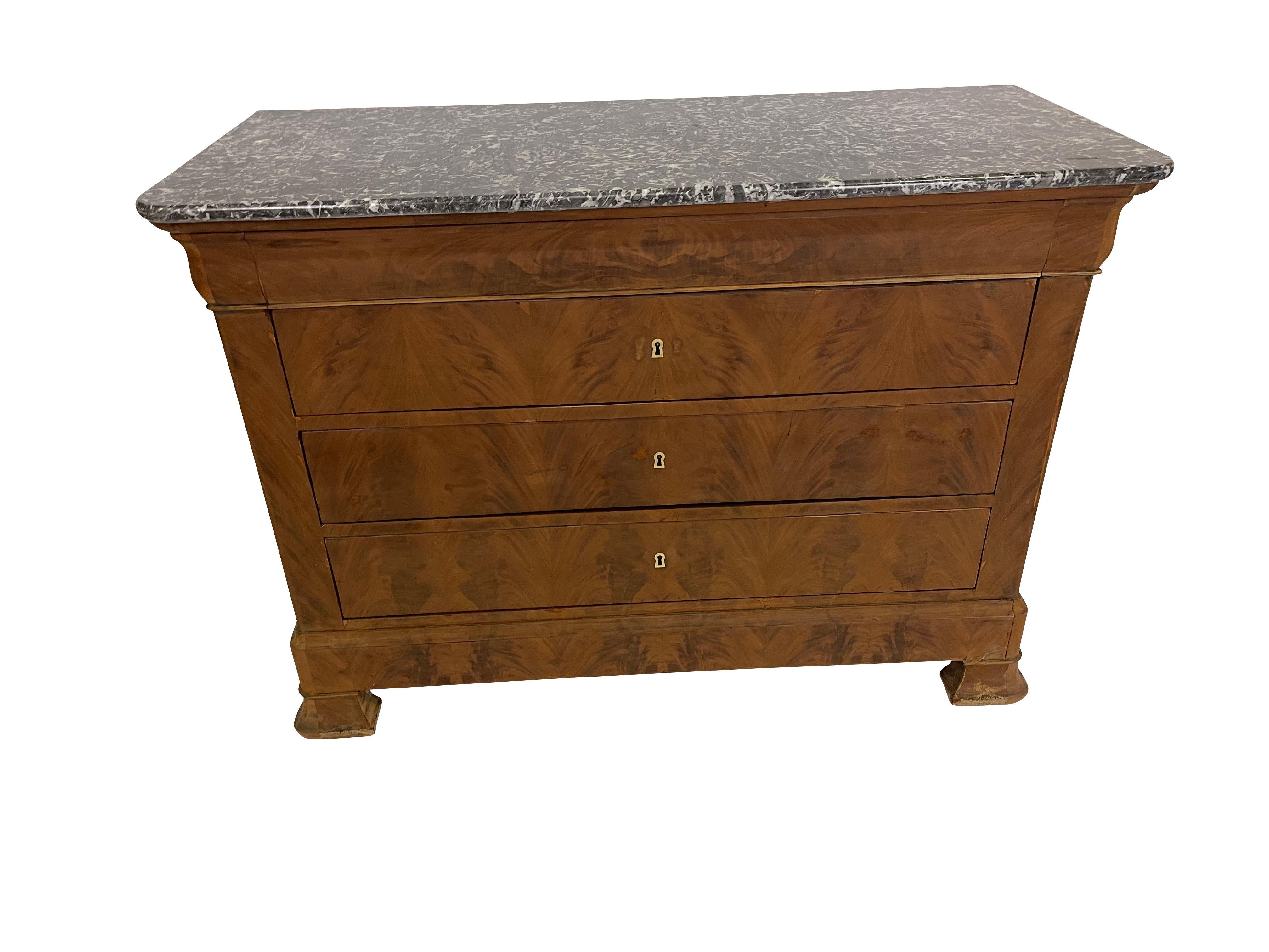 Imported from France, this 19th-century burled walnut marble top Louis Phillipe commode. The entire case is made up of wonderfully grained flame walnut that has been bleached to lighten the piece and bring out the beautiful grain of the burled