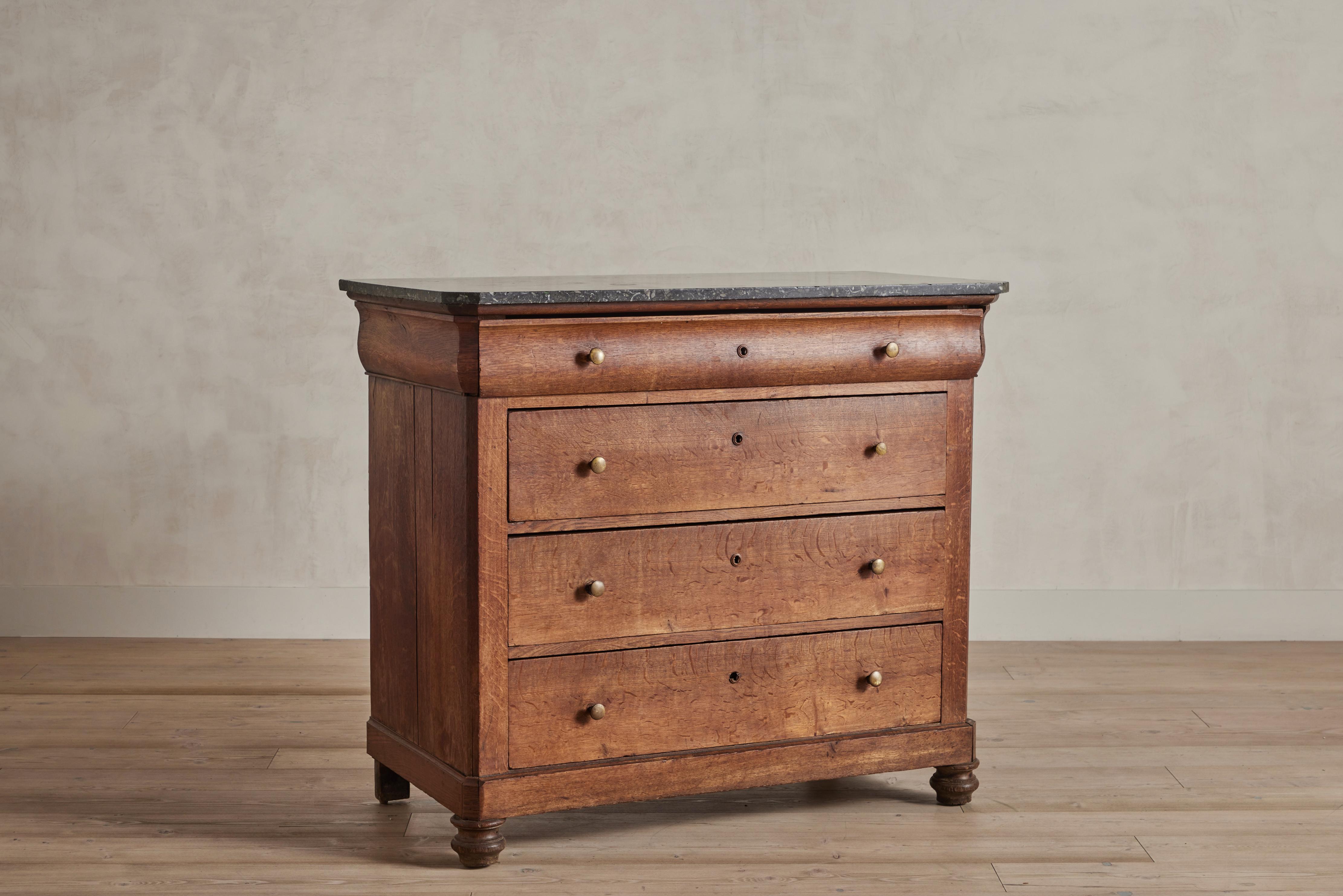 French 19th century marble top four drawer dresser from the Louis Philippe period. Wear on wood and stone is consistent with age and use.