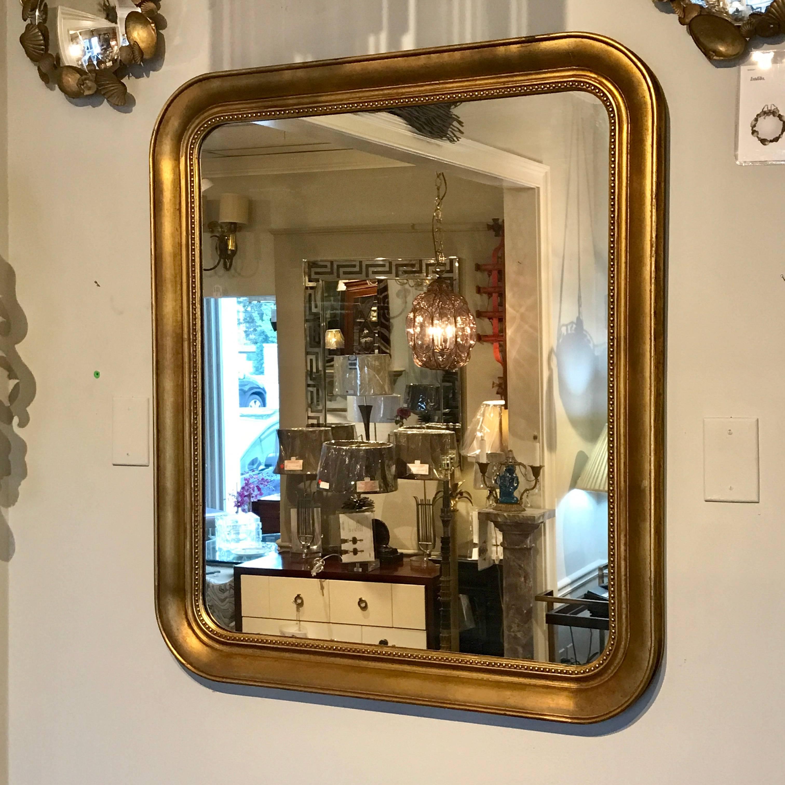 Louis Phillipe style giltwood squircle (square with rounded corners) mirror.