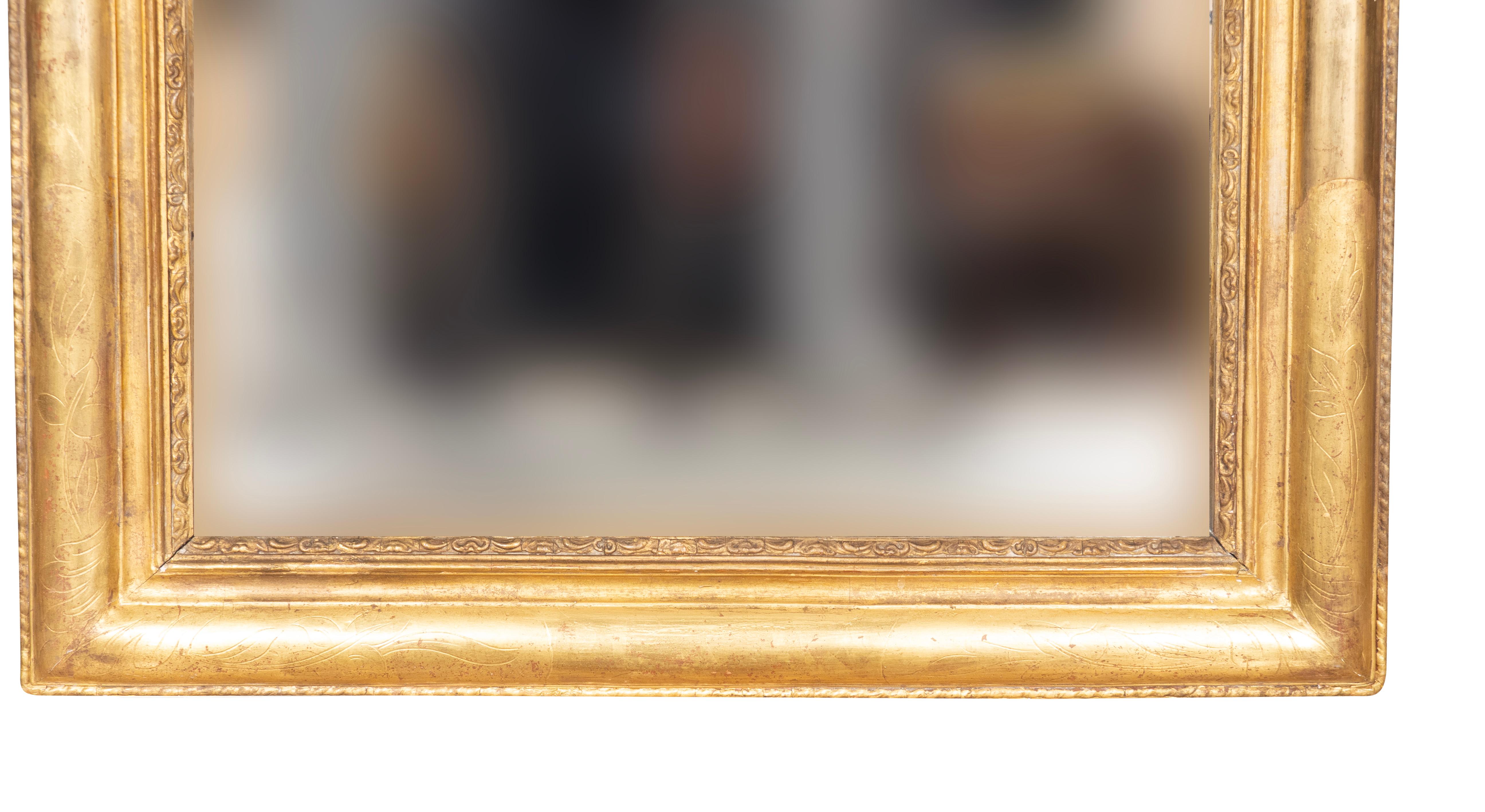 Typical form with rounded top corners. Water gilded with subtle incised trailing leaves.