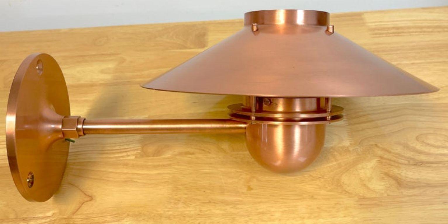 Louis Poulsen A-19 'Nyhavn' Copper Sconce by Alfred Homann & Ole V. Kjær 1976
Designed by Alfred Homann and Ole V. Kjær in 1976
Manufacturer: Louis Poulsen

Elevate your exterior or interior with the timeless elegance of the Louis Poulsen A-19