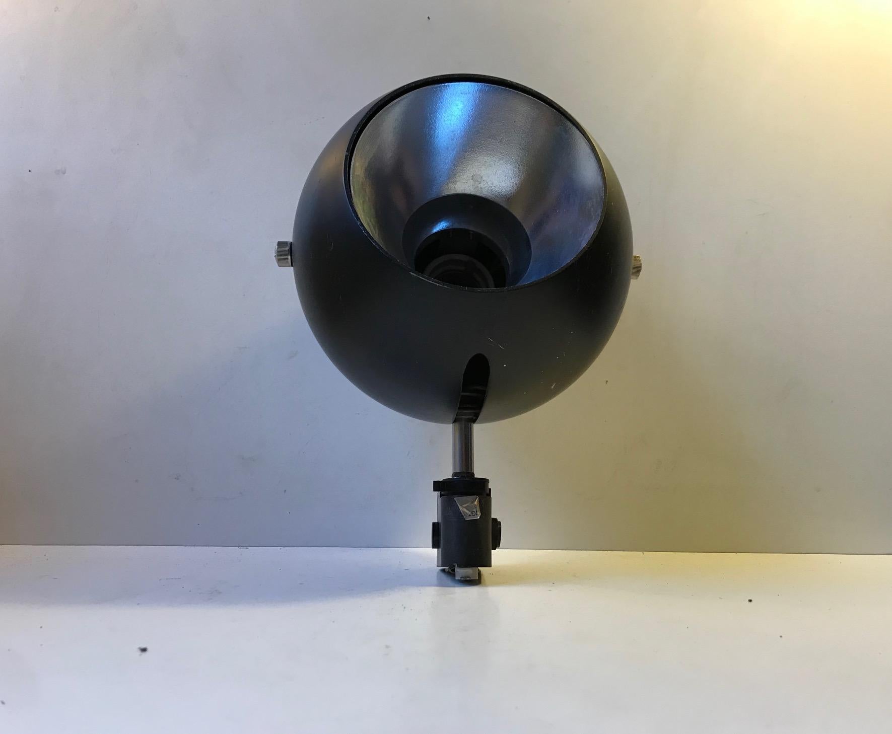 A rare Verner Panton inspired wall or ceiling sconce. Fully adjustable and made from black powder coated steel and aluminium. It is meant to be mounted on a short track and used as a spotlight. It was manufactured and designed in-house at Louis