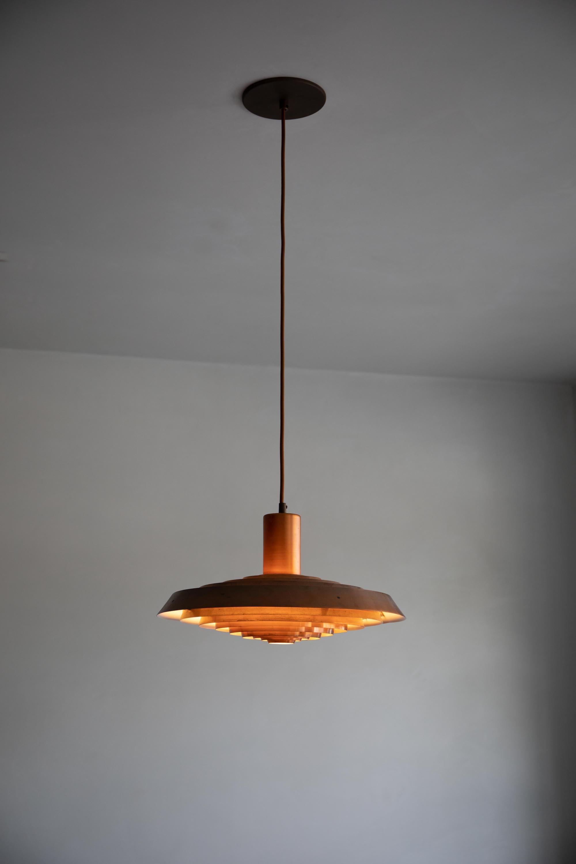 This rare copper pendant was designed by Poul Henningsen for Louis Poulsen in 1958 for the Langelinie Pavillion in Copenhagen.

It was one of the approximately twelve original ceiling lights that were commissioned from Poul Henningsen by Architects