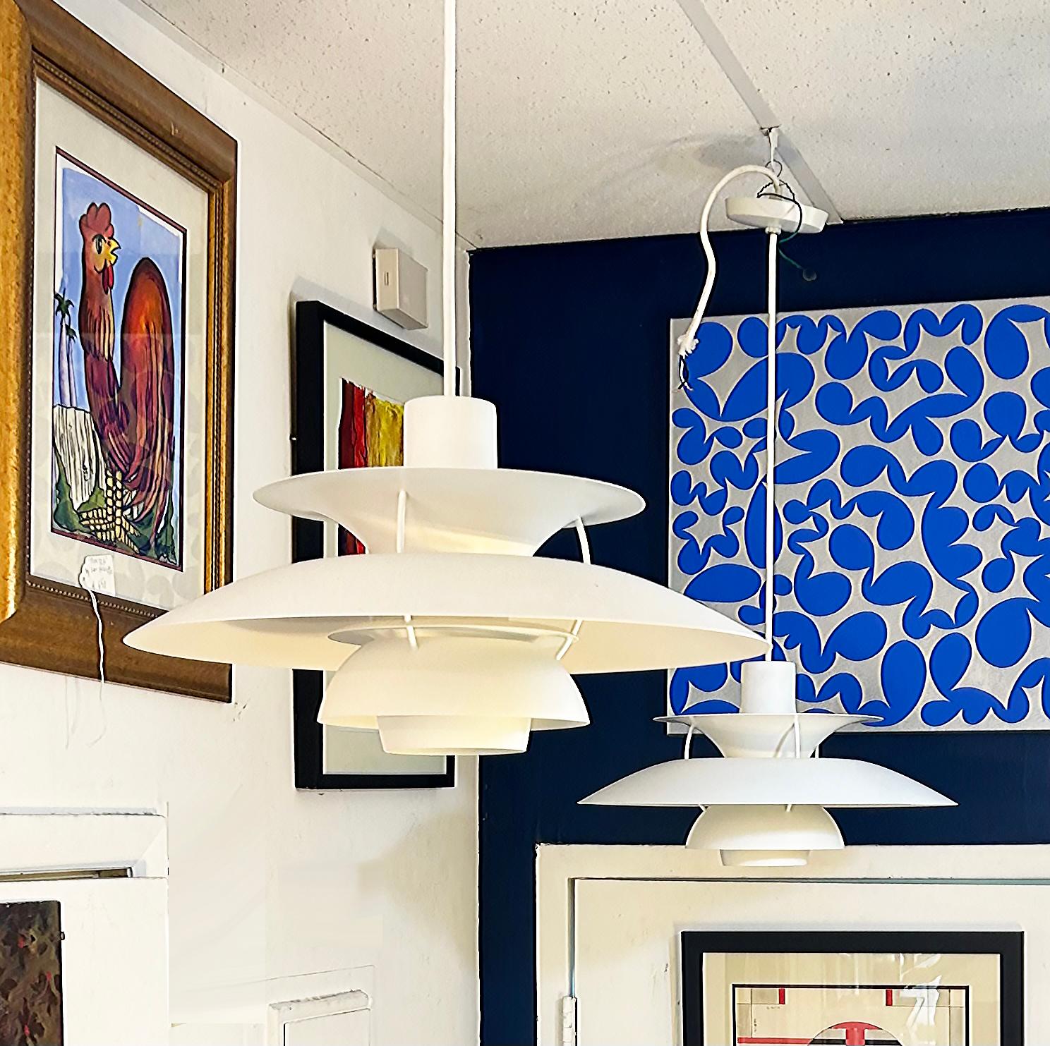 Louis Poulsen PH-5 Pendant Chandeliers for Poul Henningsen

Offered for sale is a classic Louis Poulsen PH-5 white enameled metal pendant chandelier.  This chandelier is by Louis Poulsen for Poul Henningsen. The total height or drop needed is
