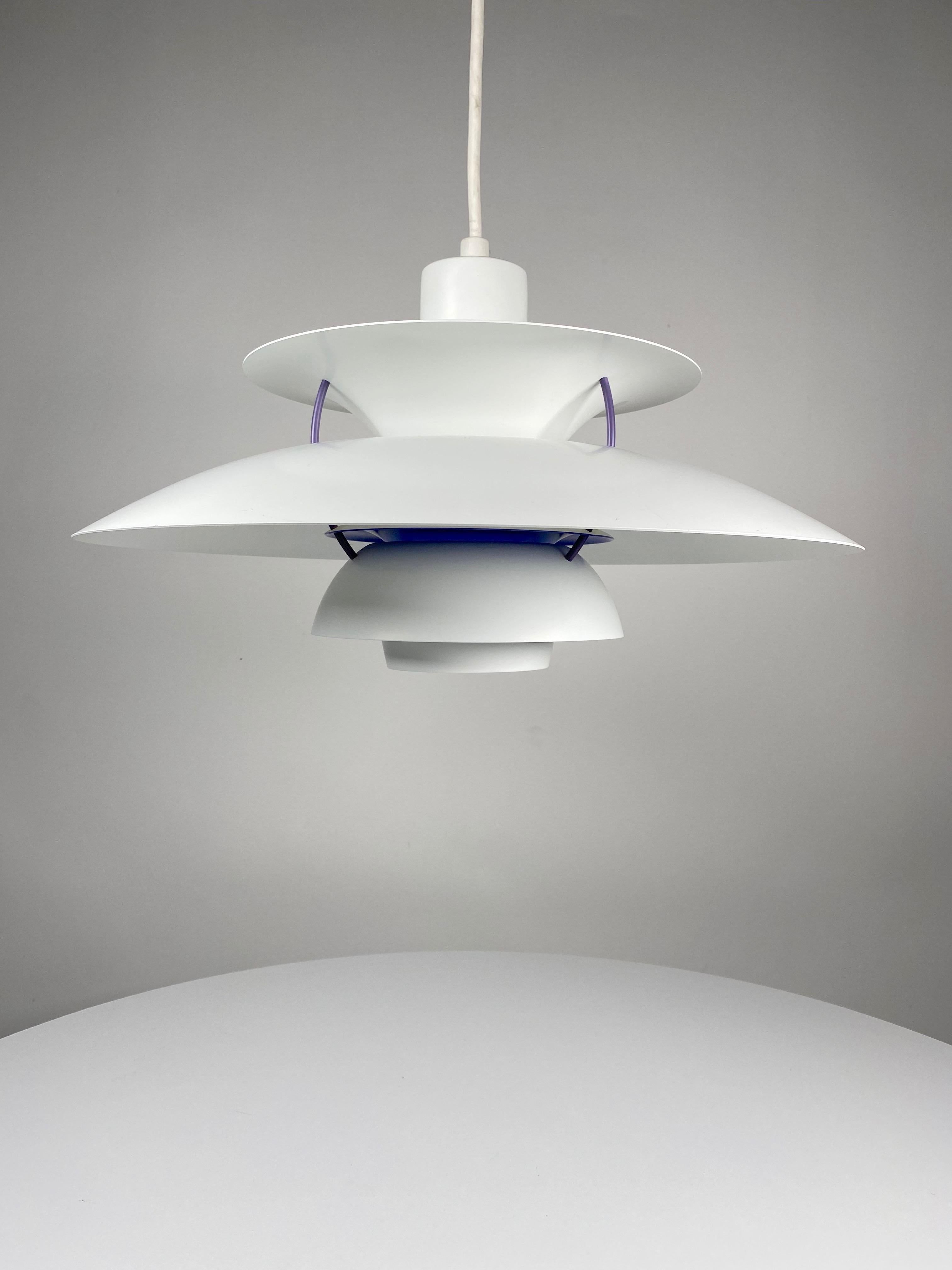The PH 5 pendant lamp by Poul Henningson (1894-1967), Danish architect and designer, the invertor of the PH series lamps, know for their glare free design which produce a soft warm even light. The lamps are produced by the Louis Poulsen and Company