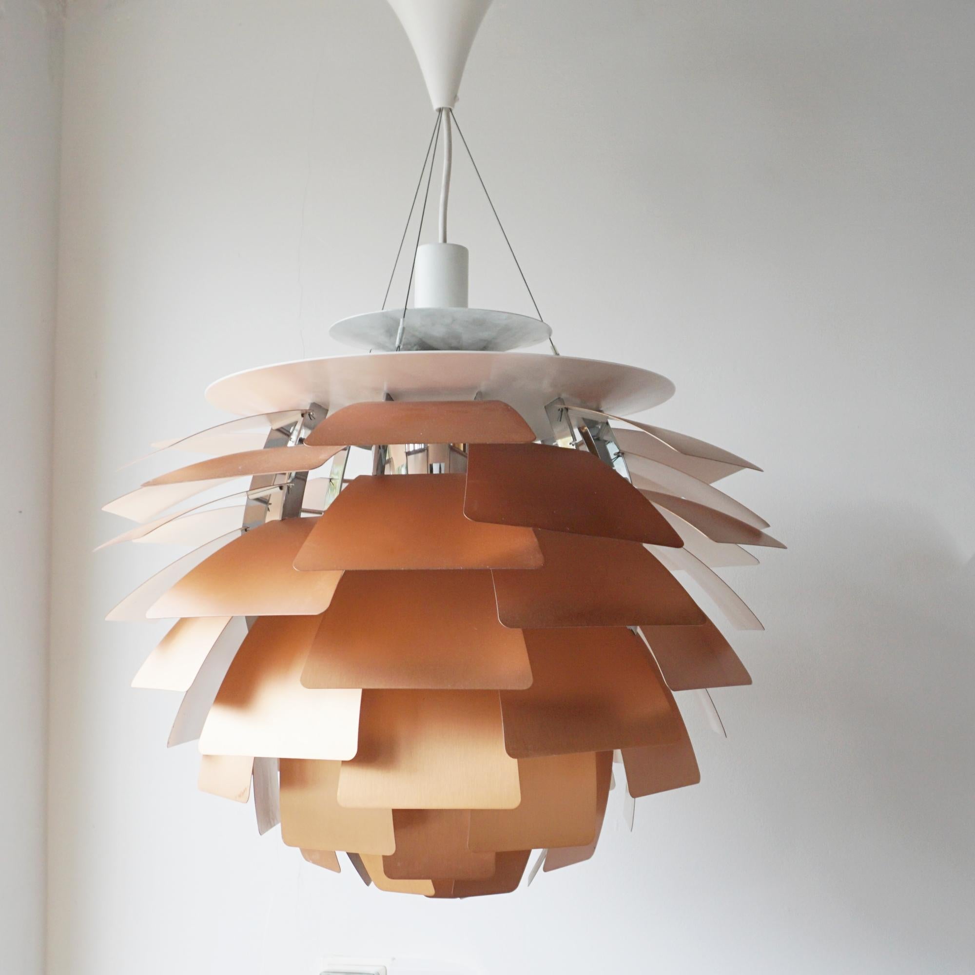Louis Poulsen 'PH Artichoke' light pendant. 72 steel leaves individually crafted by hand at Poulsen's workshop in Denmark. Suspended from chrome-plated spun aluminium cables. Model Ø60, originally designed by Poul Henningsen in 1958.

Dimensions: H