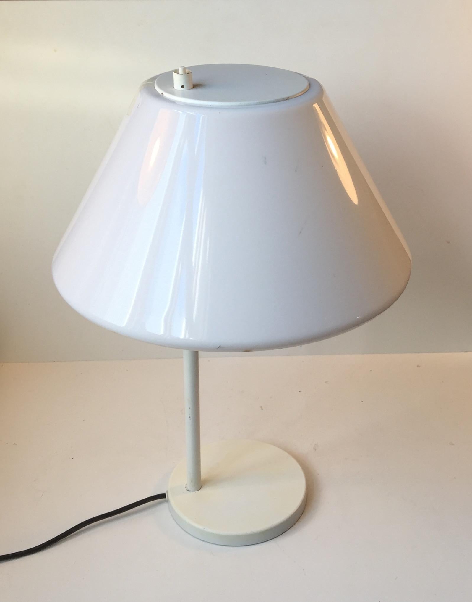 A pair of rare 'Combi' table or desk lamps designed by Danish architect Per Iversen in 1967. Manufactured by Louis Poulsen in Denmark during the 1960s-early 1980s. Very similar in construction to Hans Jorgen Wegner's Opala series with its