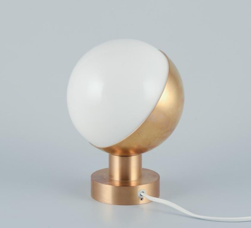Louis Poulsen, Denmark. The VL Studio Wall lamp.
The lamp was designed by Vilhelm Lauritzen (1894-1984) for The Radio House in Copenhagen in the 1940s
Made of brass and opal glass. 
Large model.
2000s.
Perfect condition. Appears new and