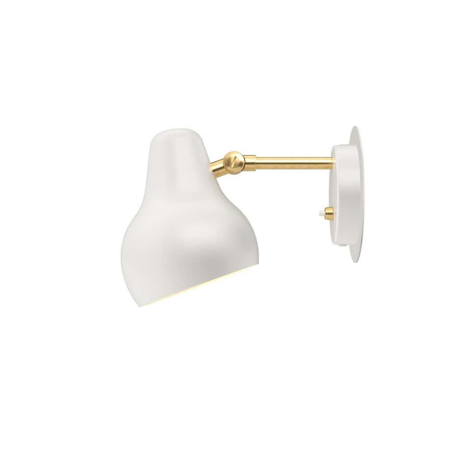 Louis Poulsen, wall lamp by Vilhelm Lauritzen
Measures: Width 135 x height 190 x length 290(mm), 1.1 kg
Material: Rear housing and shade: aluminum. Arm: brass. Cord length: 3.3 m. Switch: On the rear housing with two dimming settings. LED driver: