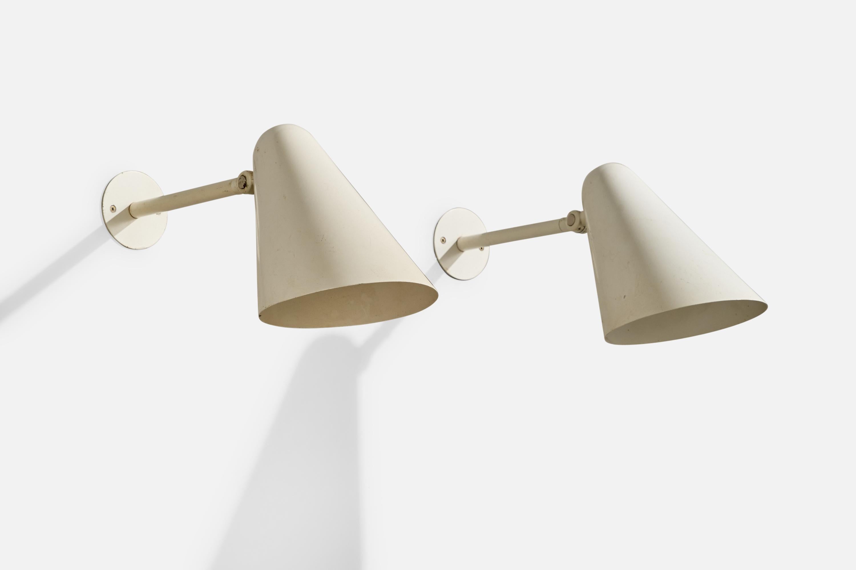 A pair of white-lacquered metal wall lights produced by Louis Poulsen, Denmark, c. 1950s.

Overall Dimensions (Inches): 7.5” H x 6” W x 16.5“ D

Back Plate Dimensions (Inches): 3.125” H x 3.125” W x .11” D

Bulb Specifications: E-26

Number of