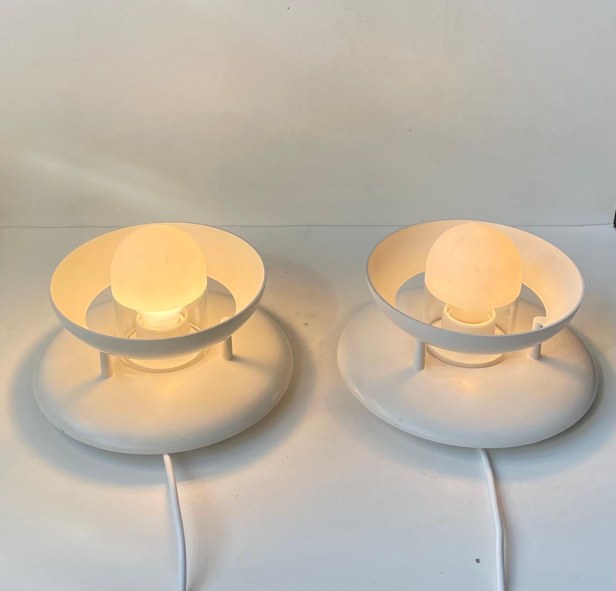 A set of white multi-purpose lamps that can be installed either as wall or ceiling lights. They are called Safir and these are the largest version of the Safir series. Designed by Marianne Tuxen during the 1980s or early 90s and manufactured by
